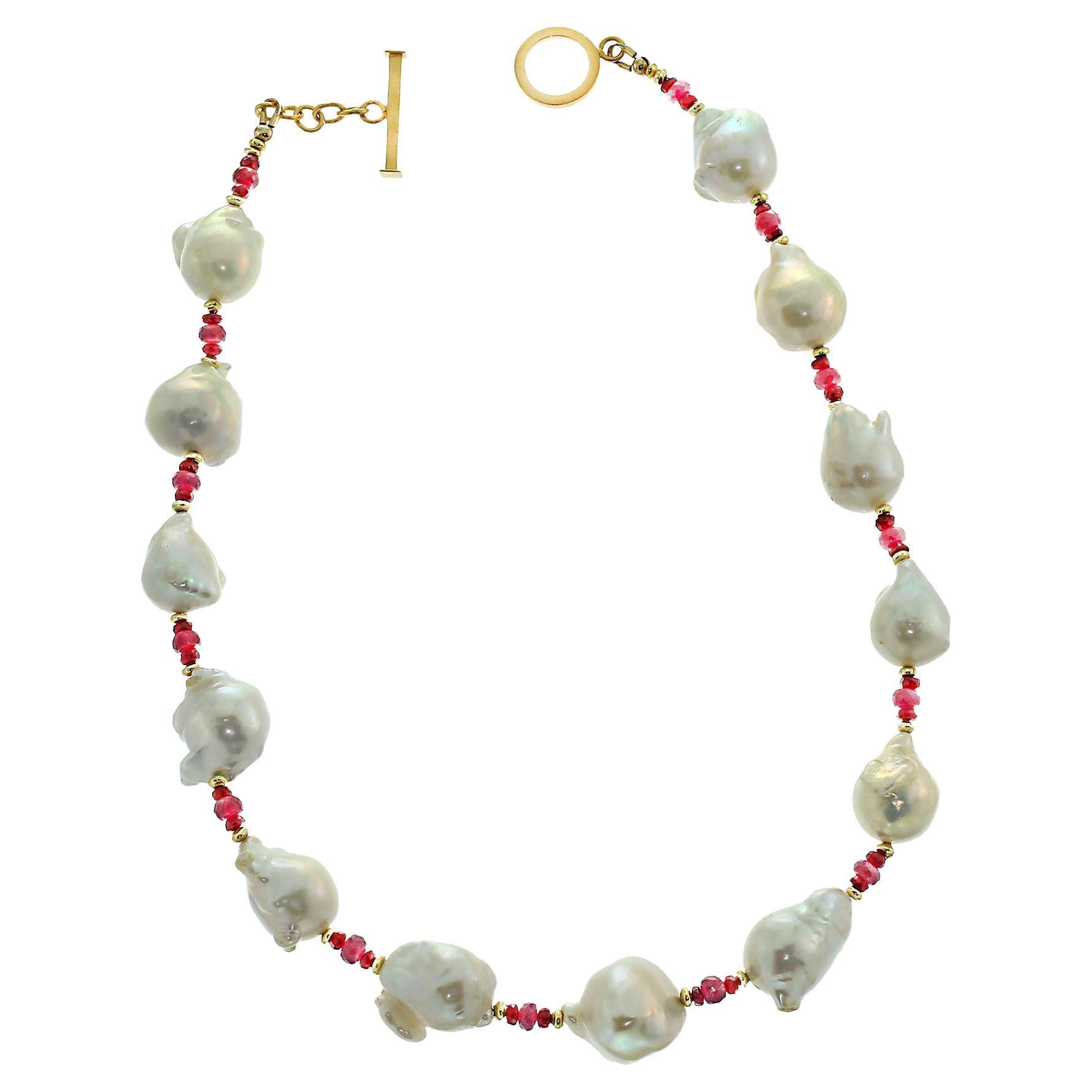 Own the jewelry you wish for

Pearls and Rubies make this custom made Choker Necklace a 'must have' in your wardrobe. These Baroque Pearls are iridescent and flash pink and yellow, each is a unique shape due to bits of nacre developing at odd
