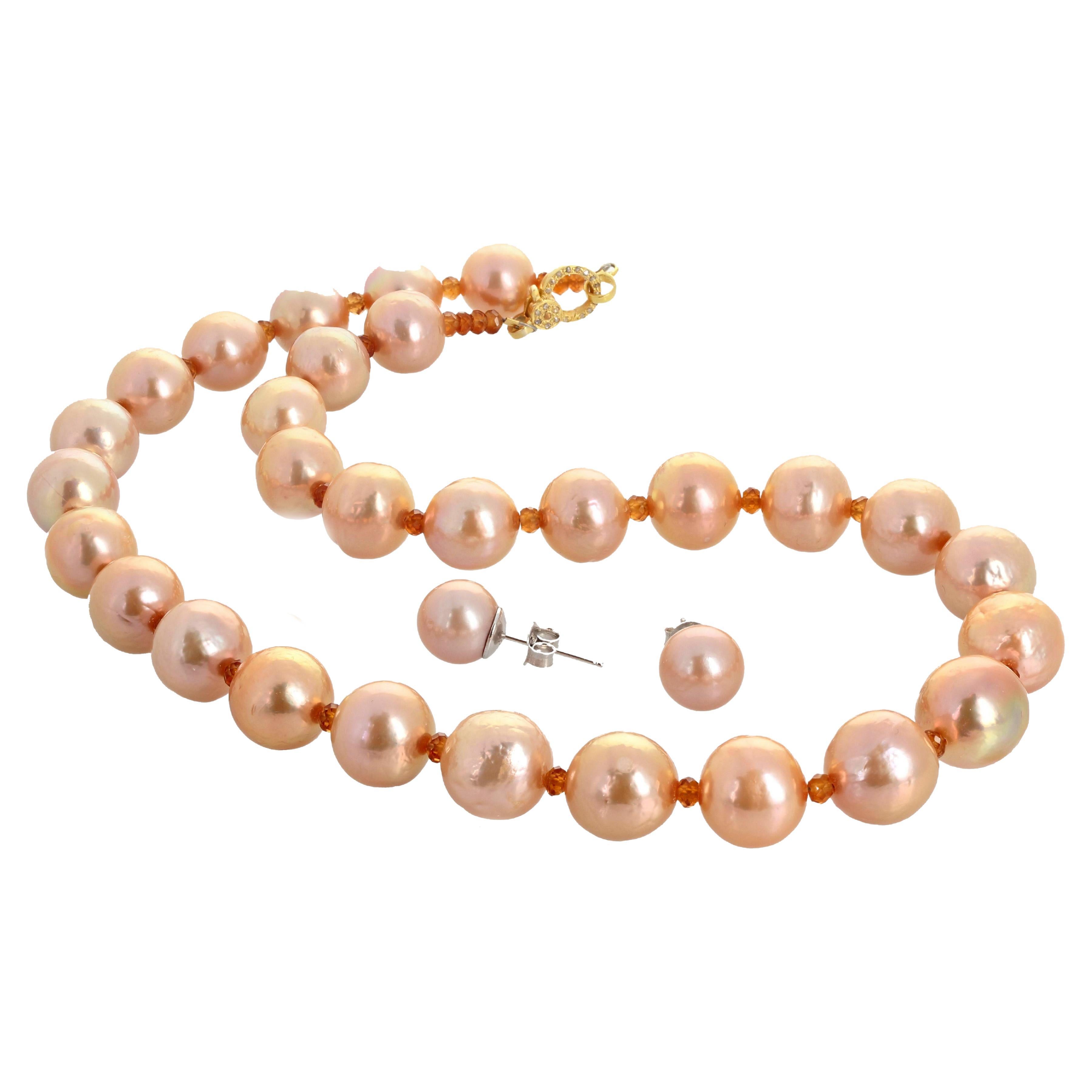 These magnificent Ocean Cultured Pearls - 13 to 15 mm - are enhanced with glittering gem cut Spessartites set in this unique 19 inch long necklace with vermeil encrusted diamond easy to use clasp..  The matching earrings are 11.5 mm.   This is quite