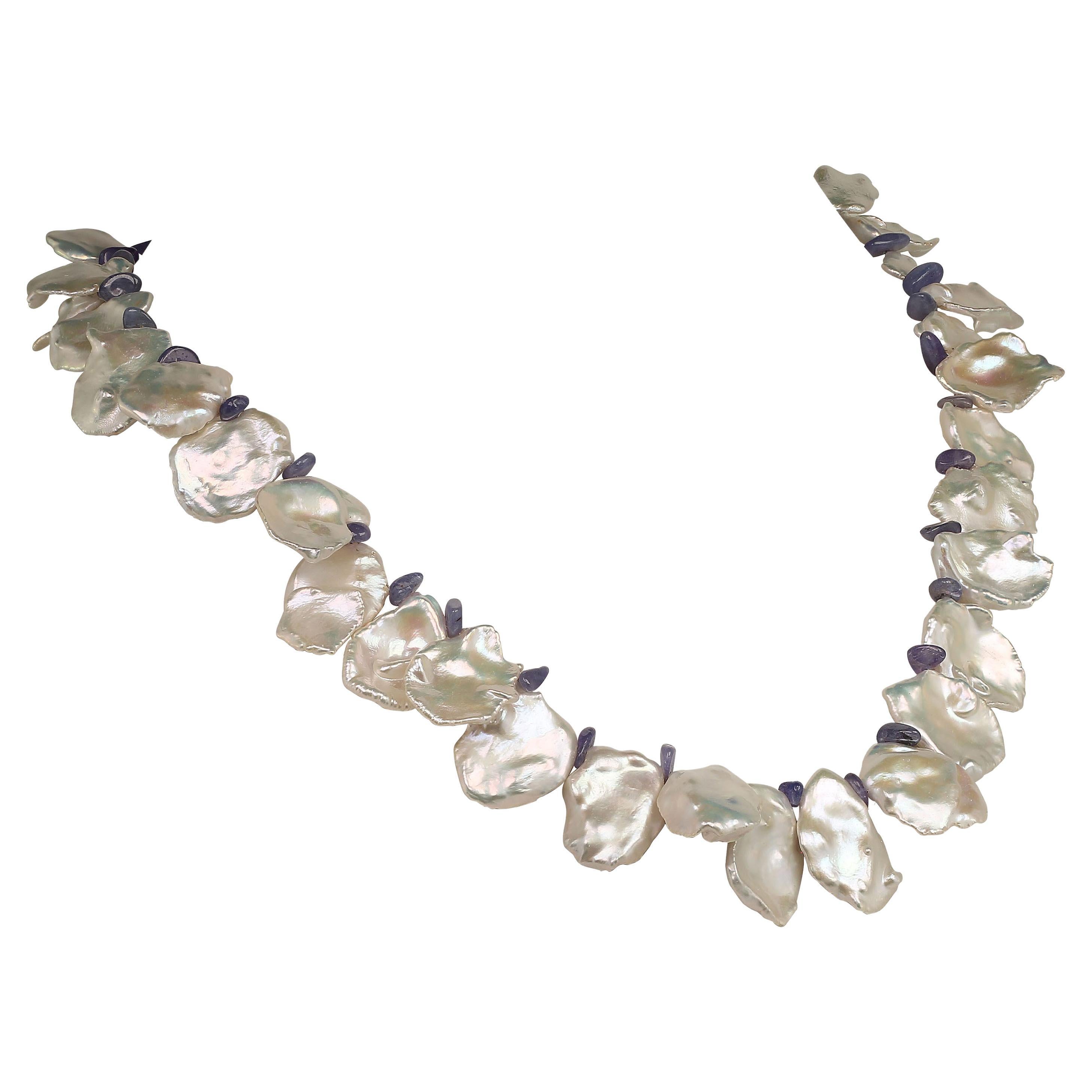 Because you deserve to wear Pearls

White and Blue, custom made Pearl necklace! Perfect for Spring. Wear these lovely large iridescent Keshi Pearls and Tanzanites with everything. They will enhance your entire wardrobe. The highly polished tumbled