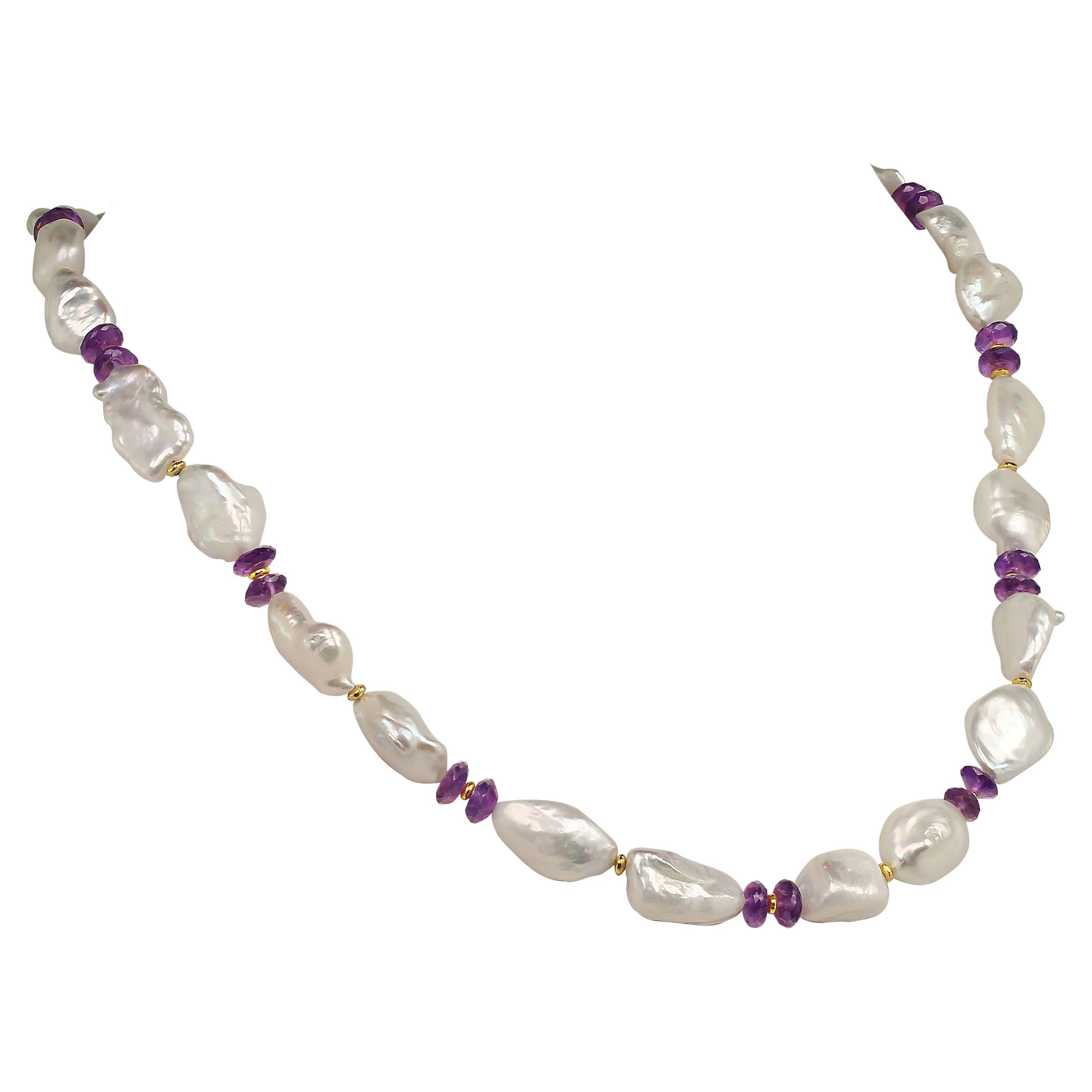 Own the jewelry you desire.

Elegant, handmade necklace of iridescent white baroque Pearls and sparkling Amethyst rondelles. Nothing is lovelier than Pearls and Amethyst! These gorgeous iridescent Pearls flash pinky next to the sparkling Amethyst