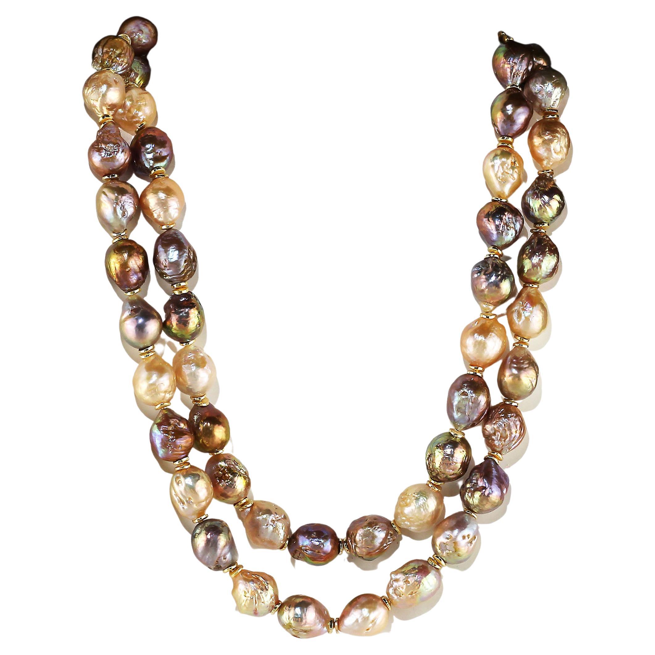 'Pearls are always appropriate' Jackie Kennedy

Elegant baroque Pearl 35 inch necklace in Natural Multi Tones. There are tiny gold tone flutter accents that bring out the goldy color and iridescent shades of these lovely Pearls. This unique necklace