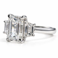 2.01 Carat Emerald Cut and 0.70 Carat Trapezoid Diamond Three-Stone Ring