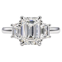 2.01 Carat Emerald Cut and 0.70 Carat Trapezoid Diamond Three-Stone Ring