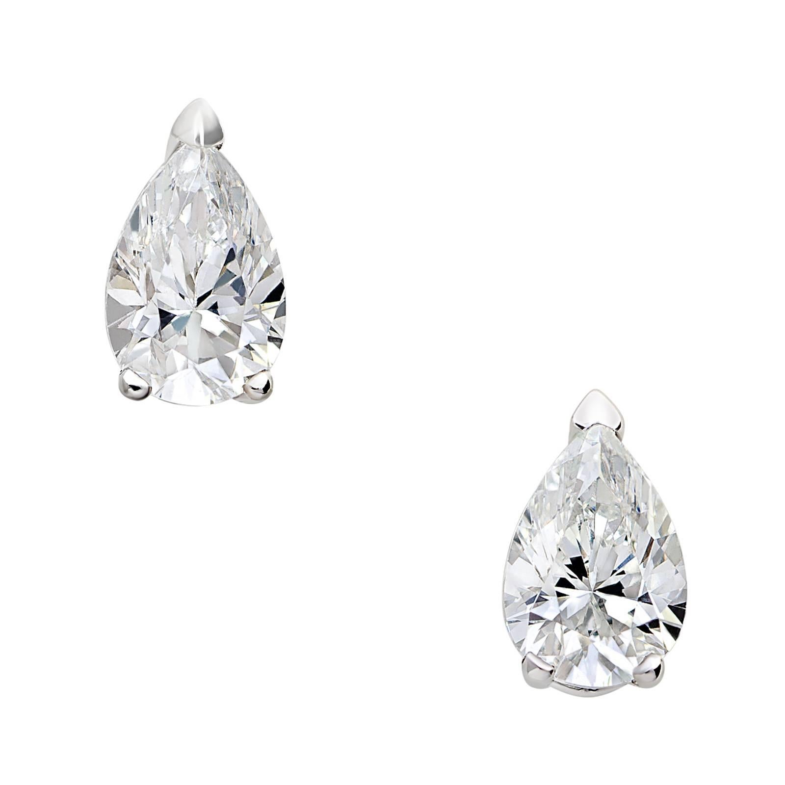A small twist on a classic stud, the Pear Diamond Studs feature 0.53 tct natural pear shaped diamonds set in an 18k white gold backing. Each diamond is set in a signature House of Eléonore « fleur » setting.
