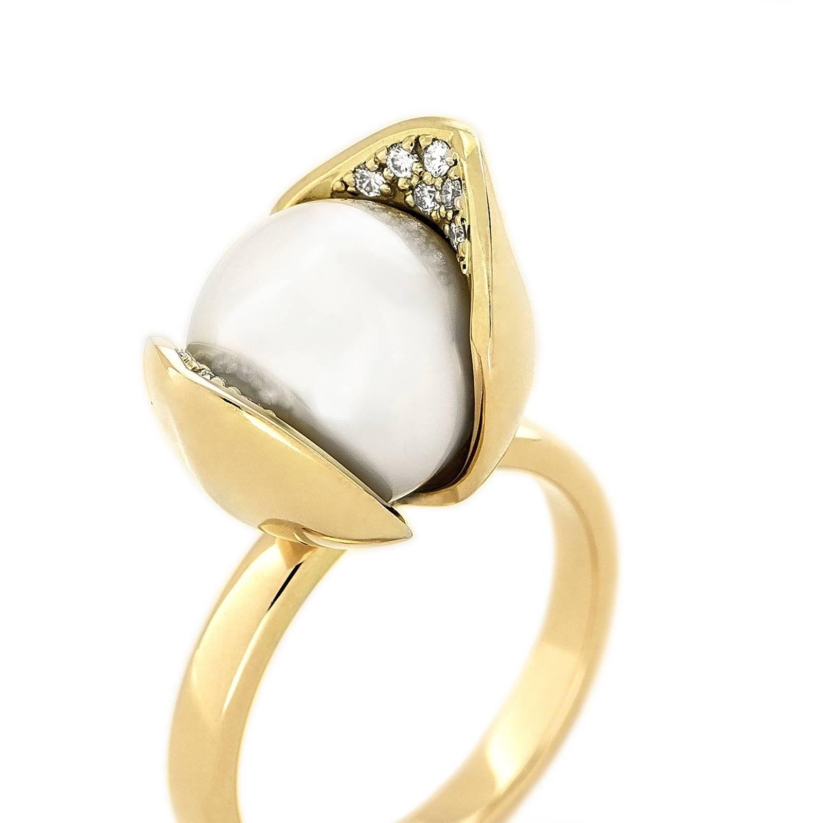 The Orchid Diamond ring encases a luminescent 10 mm South Sea cultured pearl in a delicate pod-like form. The intricate detailing of the inner petals features 0.025 tct pavé-set diamonds in 18k Fairtrade gold.