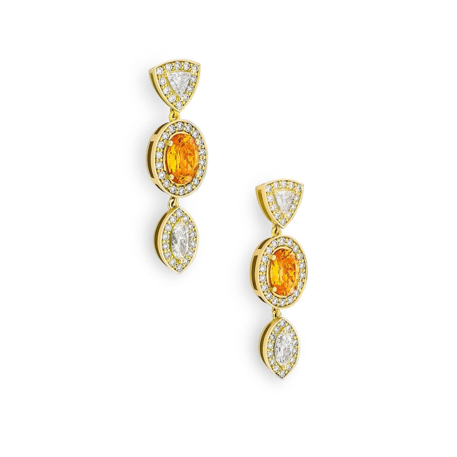 Inspired by the striking plumage of the Raggiana Bird of Paradise, the Empress Earrings combine tropical sensibilities with timeless elegance. Using a classic combination of 4.6 tct orange garnets, 1.3 tct natural marquise and trillion cut diamonds