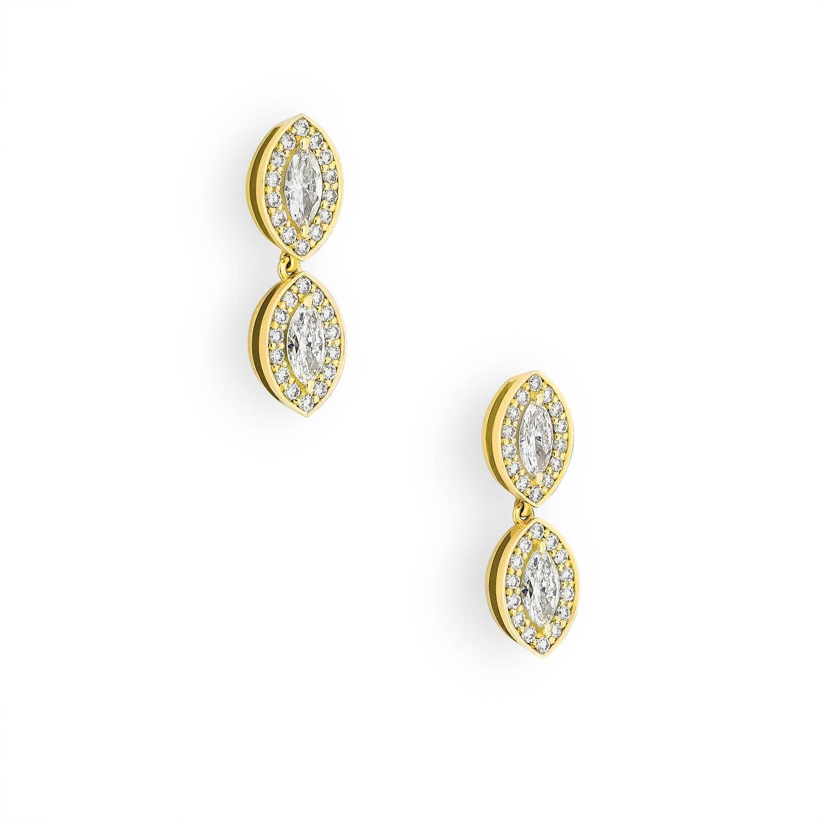 The Empress Drop Earrings are a delicate translation of the fiery Empress Earrings. By suspending two glittering 0.8 tct natural marquise cut diamonds, encircling each with 0.14 tct natural pavé-set diamonds and setting in 18k Fairtrade gold, they