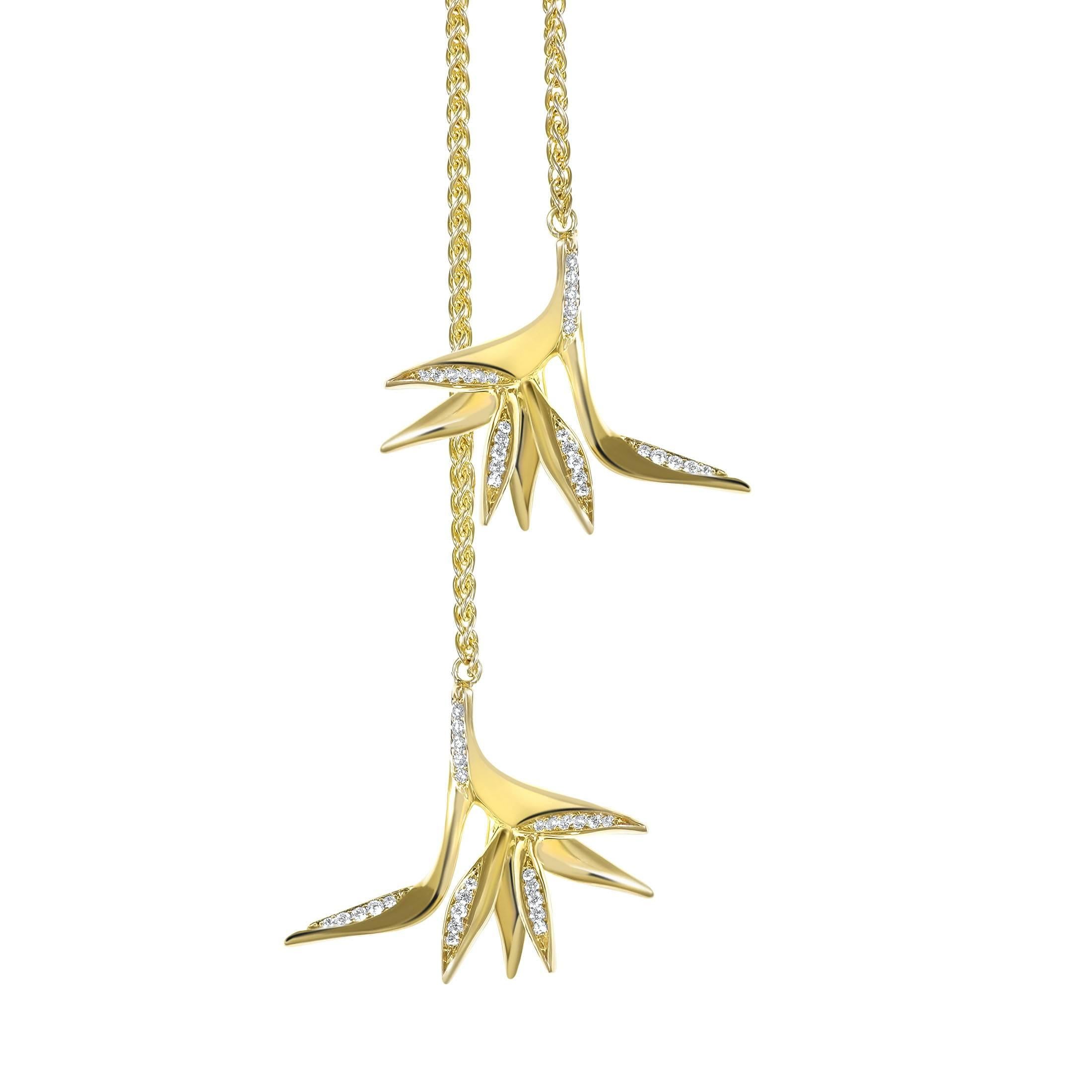 The Bird of Paradise Double Drop Necklace takes its inspiration from the long, delicate and characteristic tail feathers of the Bird of Paradise. Featuring 0.14 tct pavé-set diamonds set in 18k Fairtrade gold. 80 cm. 
