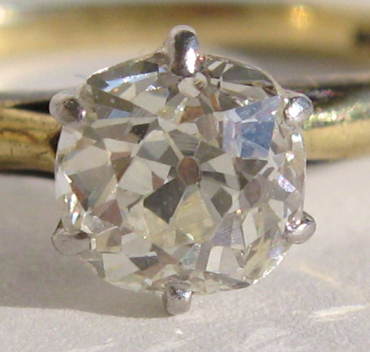Old Mine Cut diamond set in white and Yellow 18K Gold
.70 Carats
SI-1 Clarity
L - Color
Ring is a size 6.5 and can be sized up or down by us or your jeweler 
Diamond measures 5.20 x 5.30 x 3.65mm
Any questions please call or hit 