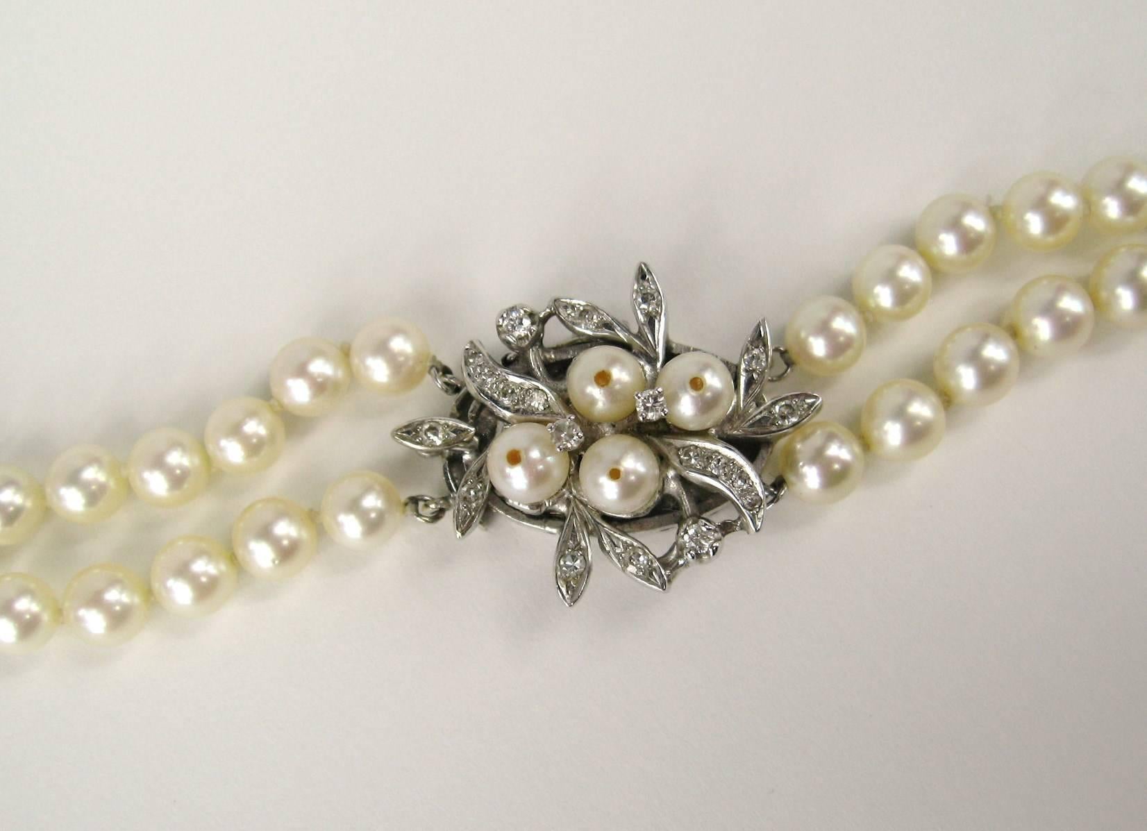 Stunning Double Strand Cultured Pearl Necklace
Floral 14K White Gold Diamond Clasp 
Pearls measure 
8.75mm down to 5.50mm 
Slide in clasp 
17 in Long on lowest strand
Any questions please call or hit request more information 