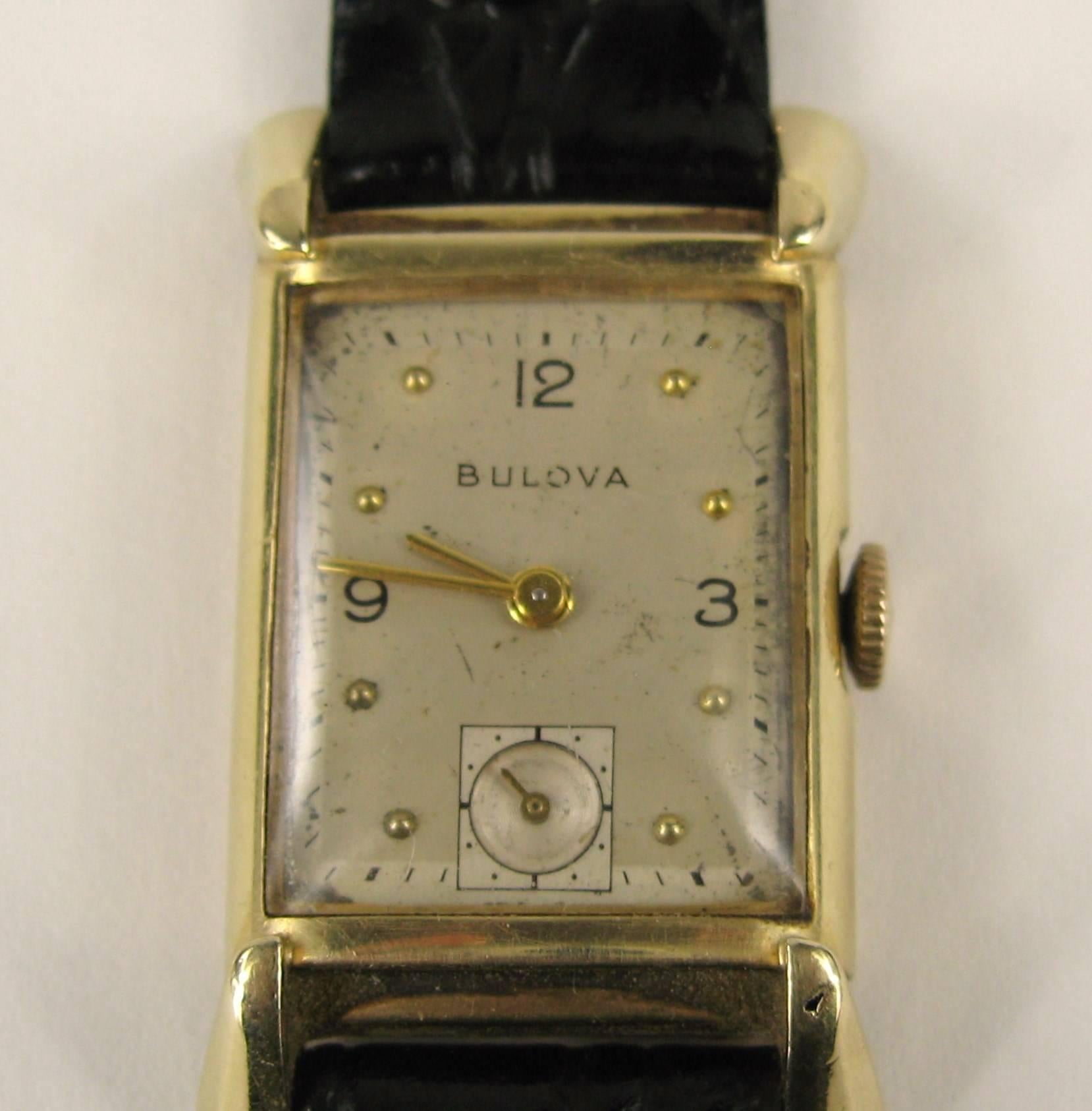 Vintage Bulova Tank Watch 

Bulova case has an elegant curve with wave like frame.
14K gold. 
Marked inside case back: Bulova; 14K gold. 
Stamped on the case back 14K Gold; Bulova L1; 7677344
In working order
Measuring 
38.58MM luge to luge