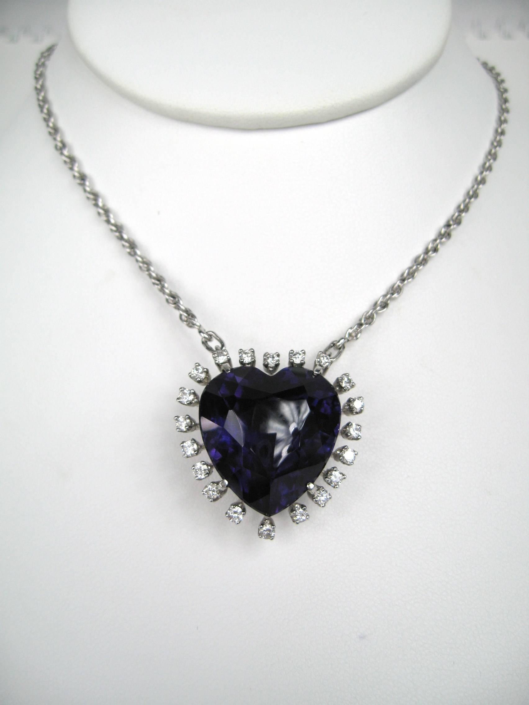 Stunning Custom Made Amethyst Heart Pendant set in Platinum and surrounded by 20 Brilliant cut Diamonds. Drops down to 19 in long Platinum Chain is affixed to pendant.
Pendant measures 1.12 in x 1.13 in, Center Amethyst is 36 Carats, 20 Brilliant