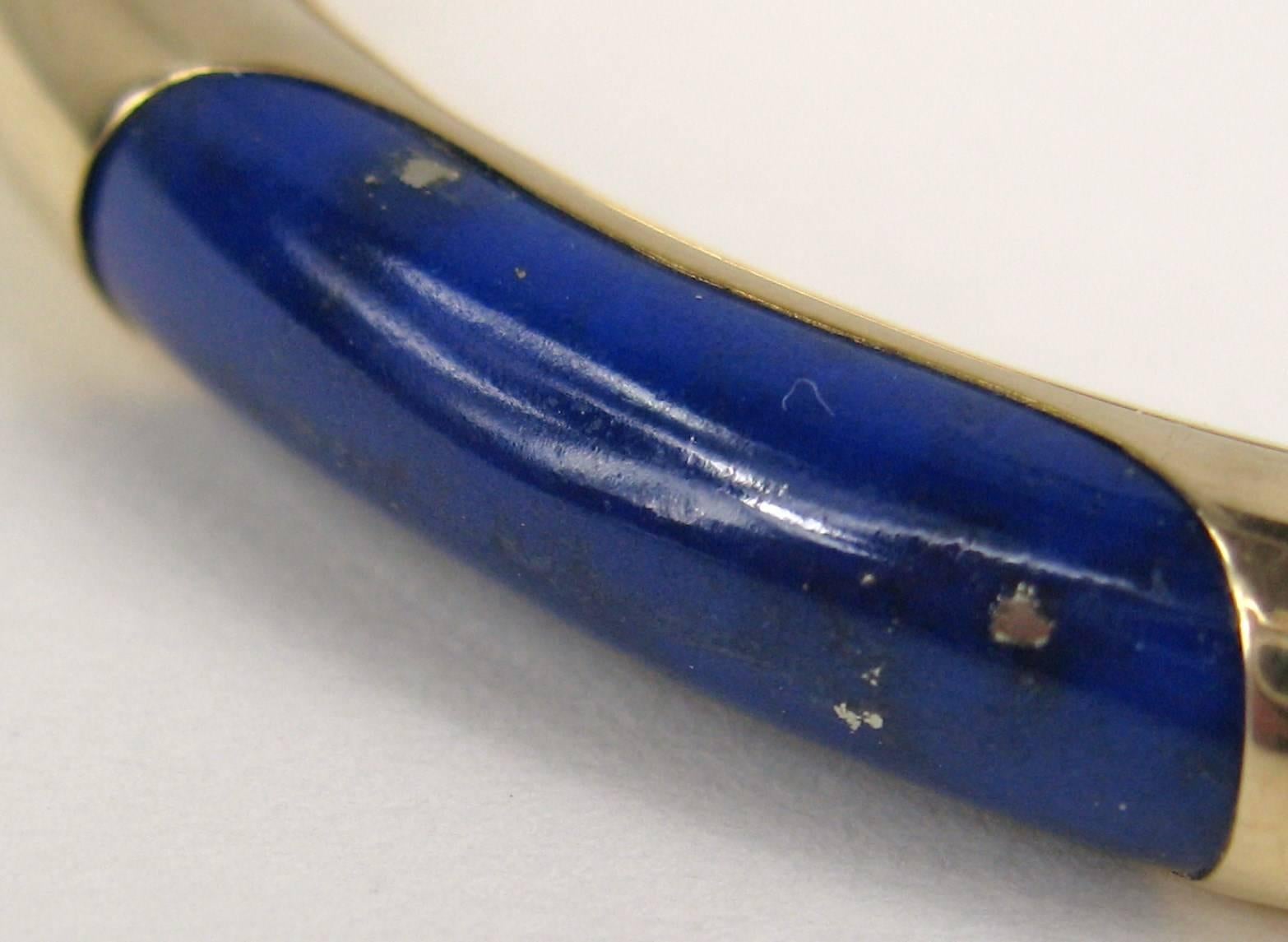 Gump's of San Francisco Lapis and 14Kt Gold Bangle. Double safety clasp, Stunning Lapis panels surrounded by Gold. Measuring 2.30 in inside, 2.75 in outside. Will fit a 6 to 7 in wrist nicely. Any questions please call or hit request more