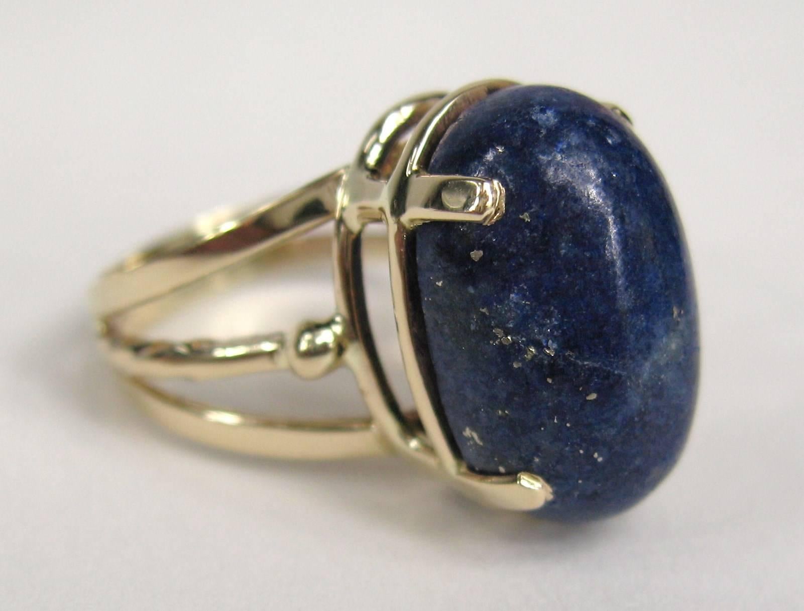 Large Lapis Lazuli set in 14K gold ring. The ring is a size 7-1/4  and can be sized by us or your jeweler. The size of the lapis is approximately 6.69 mm x 10.80 mm. This sits up .50 in on your finger. This is out of a massive collection of