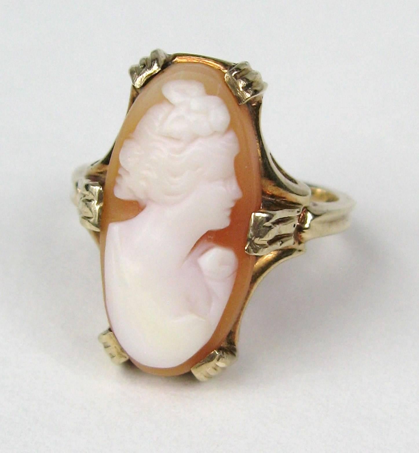 Delicate cameo ring set in 10k Gold, Stunning side profile of a lady, Ring measures .83 in top to bottom. Ring is a size 7 and can be sized by us or your jeweler. Any questions please call or hit request more information.