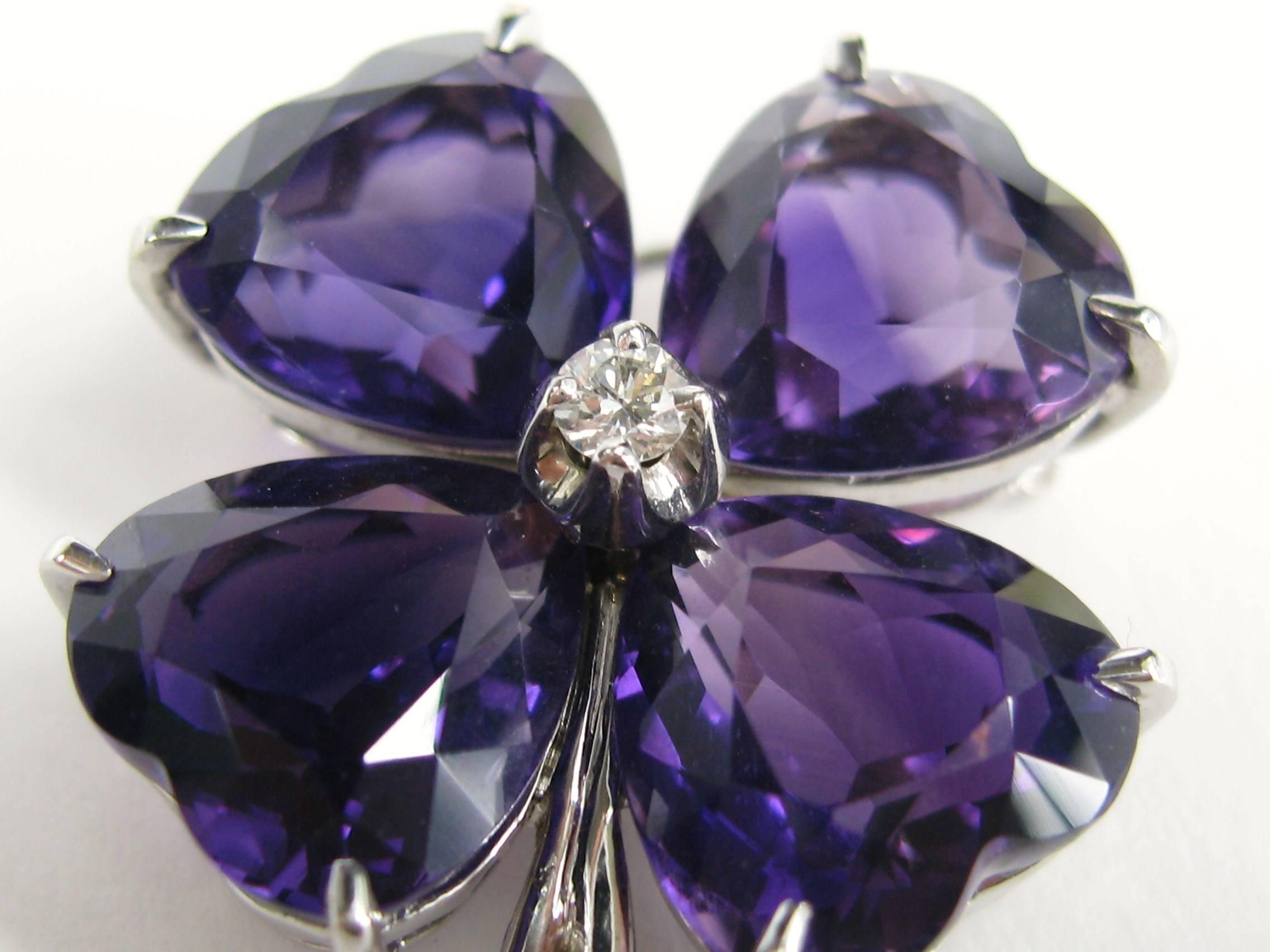 This is fabulous. We have here a Custom made FFF Platinum Amethyst clover Pin.  Matching Earrings also listed on our storefront. Heart cut Amethysts. Brooch measures 1.40 inches Top to bottom x 1.04 wide.  Please check our storefront for hundreds of