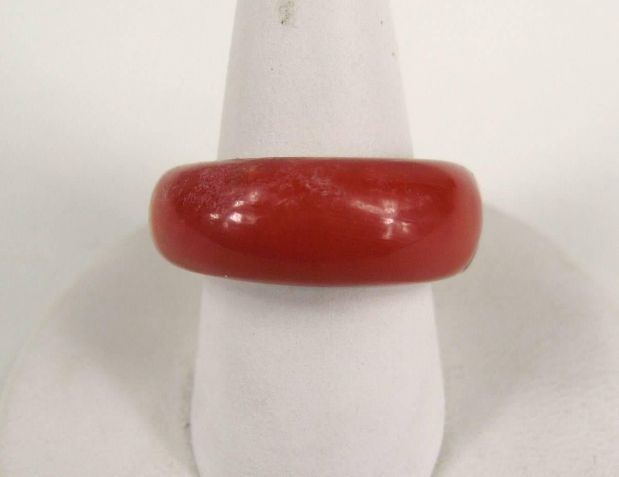 Very Modernist on this 10K gold & Red stone Ring. Sleek modern design that is timeless. The Ring is a size 6 and can be sized up or down by us or by your jeweler. 
