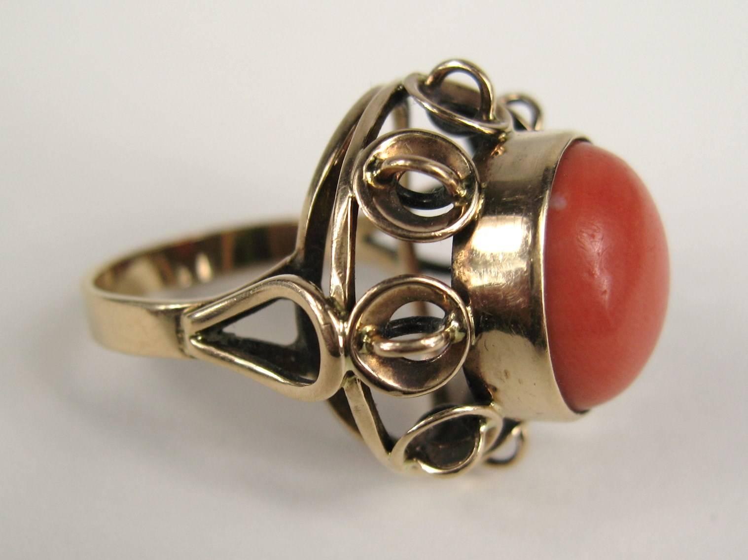 Wonderfully crafted Coral ring set in 14K gold. Measuring approximately .80 x .60 high sitting on your finger. Coral is 13.75mm x 8mm over 10 carats. The Ring is a size 8 and can be sized up or down by us or your jeweler. Be sure to check our store