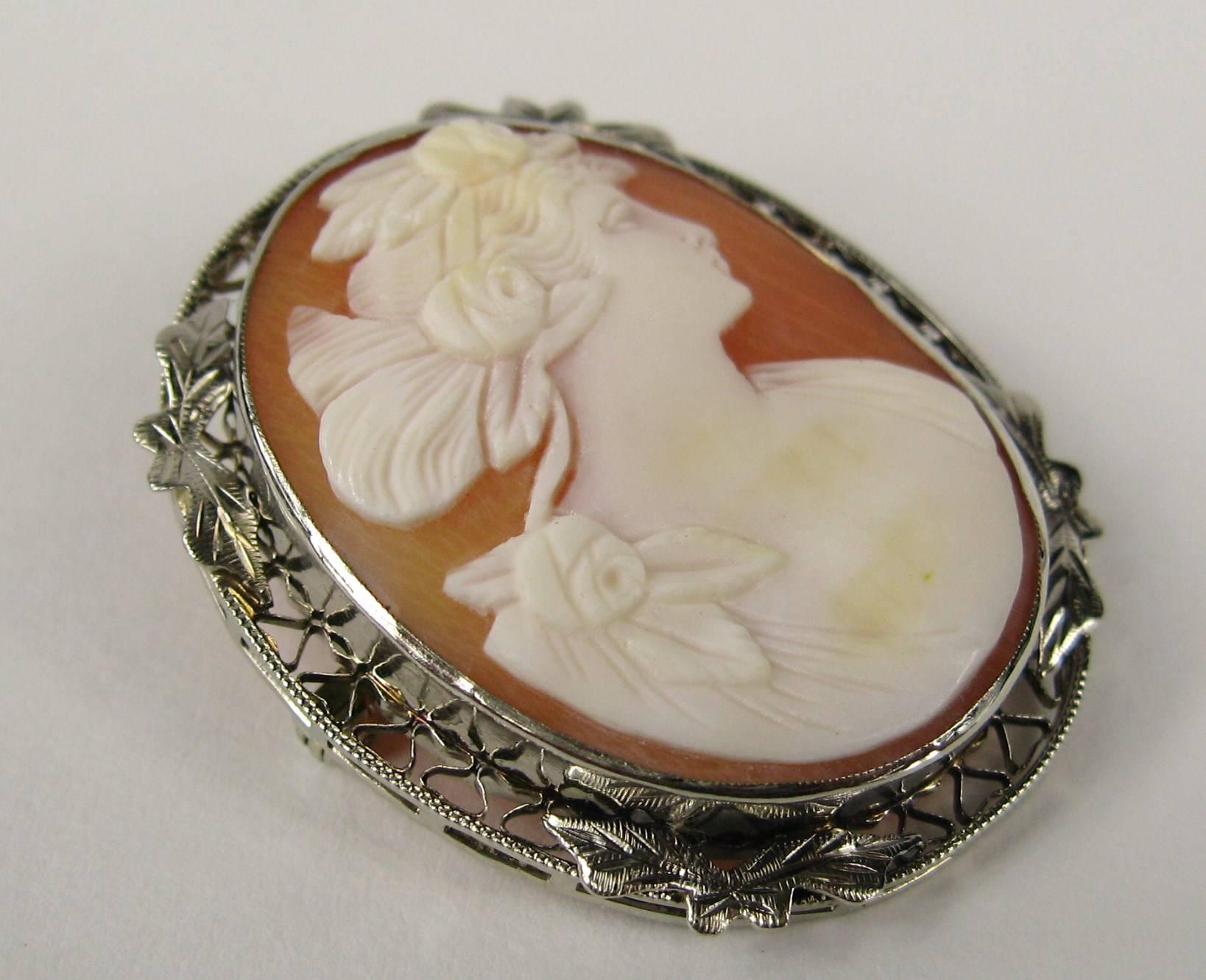 Portrait Cameo set in 14K gold. It's Both a brooch and pendant. Measuring 1.37 in top to bottom x 1.11 in wide. Fold down pendant hoop and pin back all in working order. This is out of a massive collection of Contemporary designer & Vintage clothing
