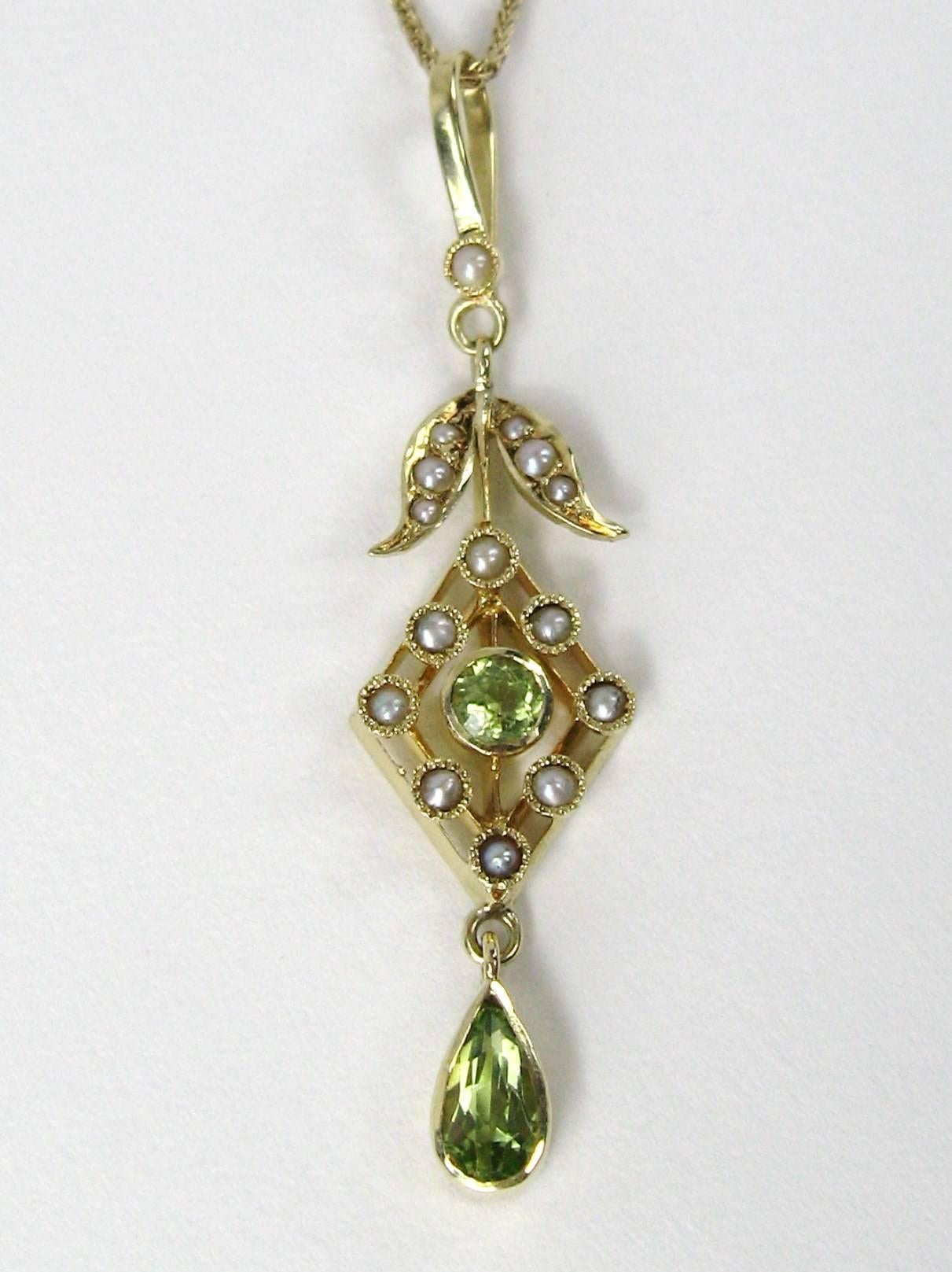 Delicate in its design, this stunning 14K gold Lavalier is a show stopper. Floral design with bezel set seed pearl and Peridot. Pendant measures - 1 13/16 in top to bottom x 5/16 in at its widest - Chain is 18 in long. This is out of a massive