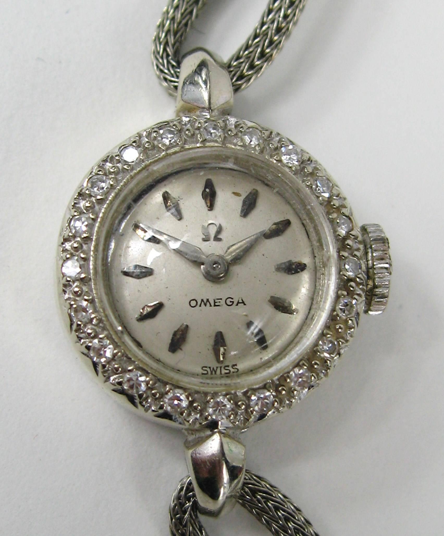 This Omega Watch has a  solid 14K white gold case and a gold filled Band. *17 jewels movement* Hi grade 481 early tiny caliber movement * 2 positions * 
You have to slide your hand into the watch band. Watch is in working condition. The watch