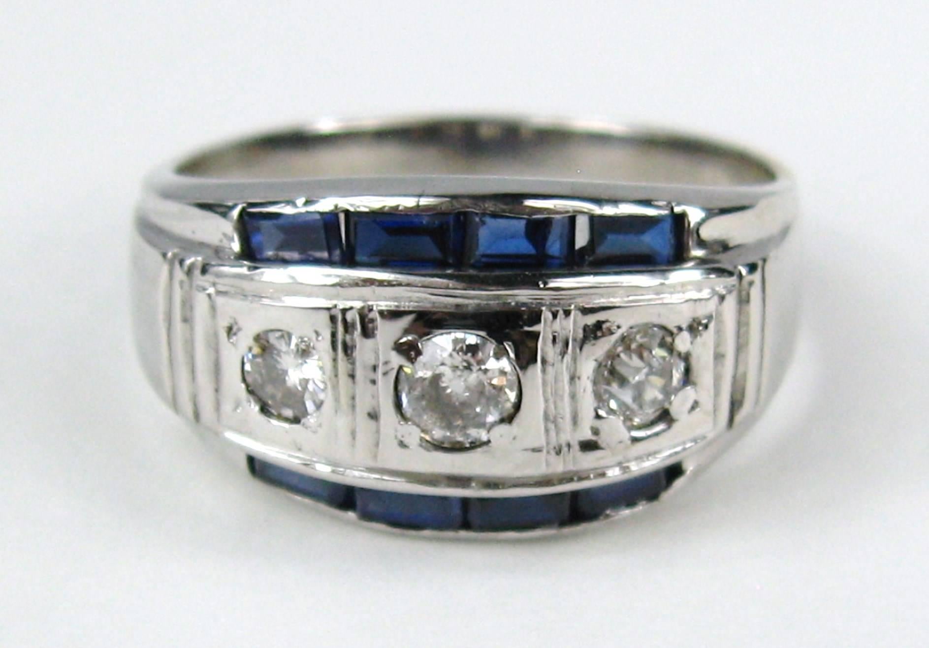14K white gold early mid century diamond Ring, Can be worn by both a man or woman. The ring is a size 11 and can be sized by us or your jeweler. Diamonds equal .65 points (Old Euro Cut Diamonds) Blue sapphire colored stones .75 points. Be sure to
