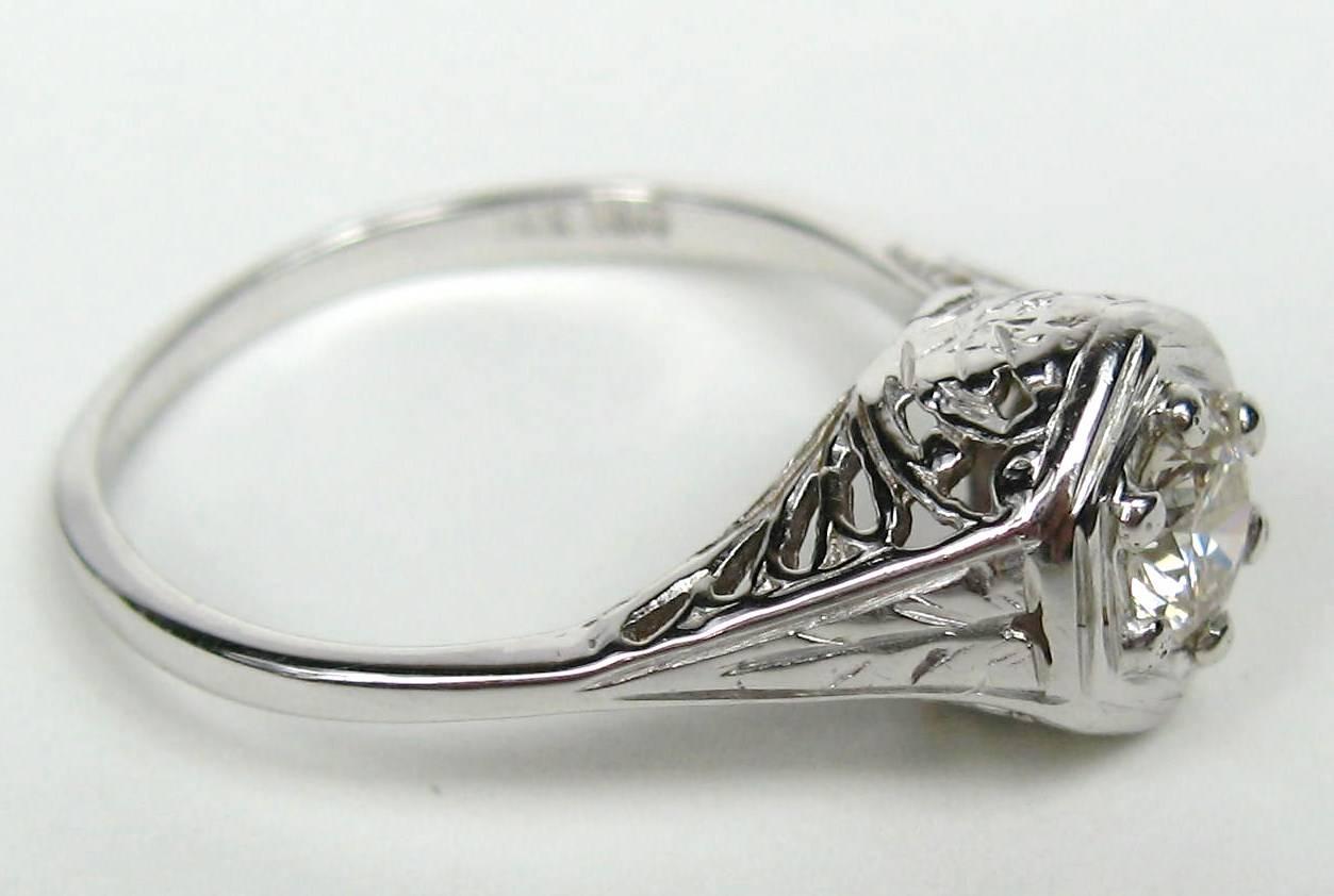Another stunning Diamond Ring circa 1930s. What a wonderful Engagement Ring this will make! 14K White Gold Setting with a .45 Ct Center Stone, VS-2 Color G measuring 5.00mm x 2.80mm, Custom Made Size 8.5 Can be sized by us or your jeweler. Please be