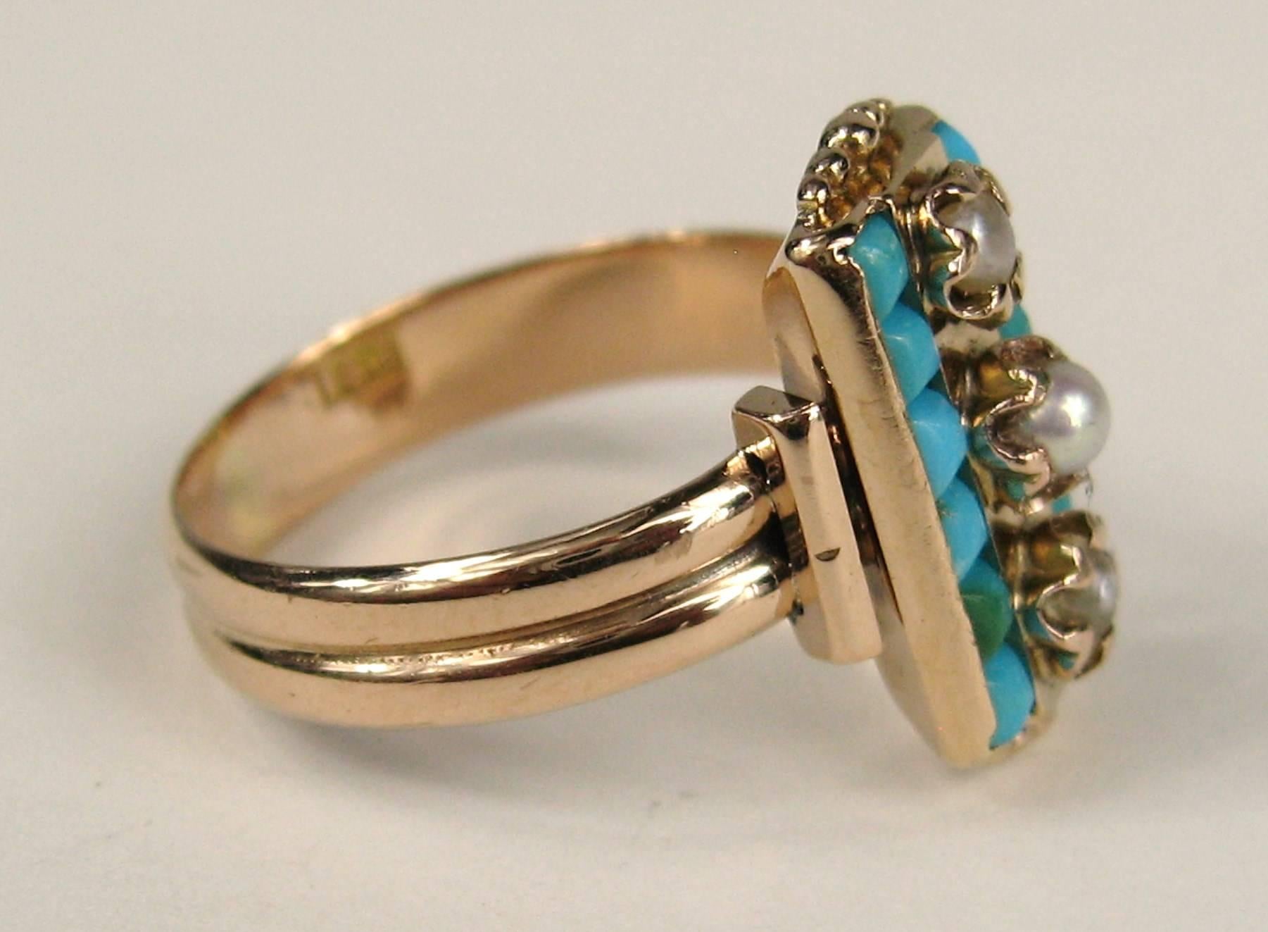 This is stunning in person, 14k Rose gold ring with bezel set Turquoise and 3 pearls running down the middle. The ring is hallmarked inside the band. Ring measures a 7-1/4 and can be sized by us or your jeweler. Measuring .65 inches top to bottom