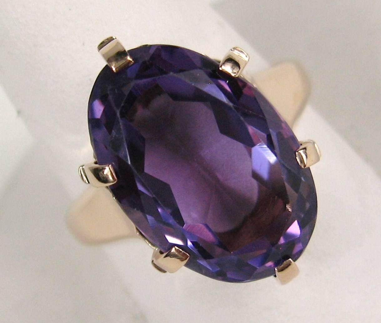 Oval Cut Faceted Amethyst Stone sits high in a Basket Claw 14K Rose Gold setting that is hand made, Looks Early. Presentation on this is spectacular. The ring is a size 6.5 and can be sized by us or your jeweler.  The ring sits .30 in High.  The