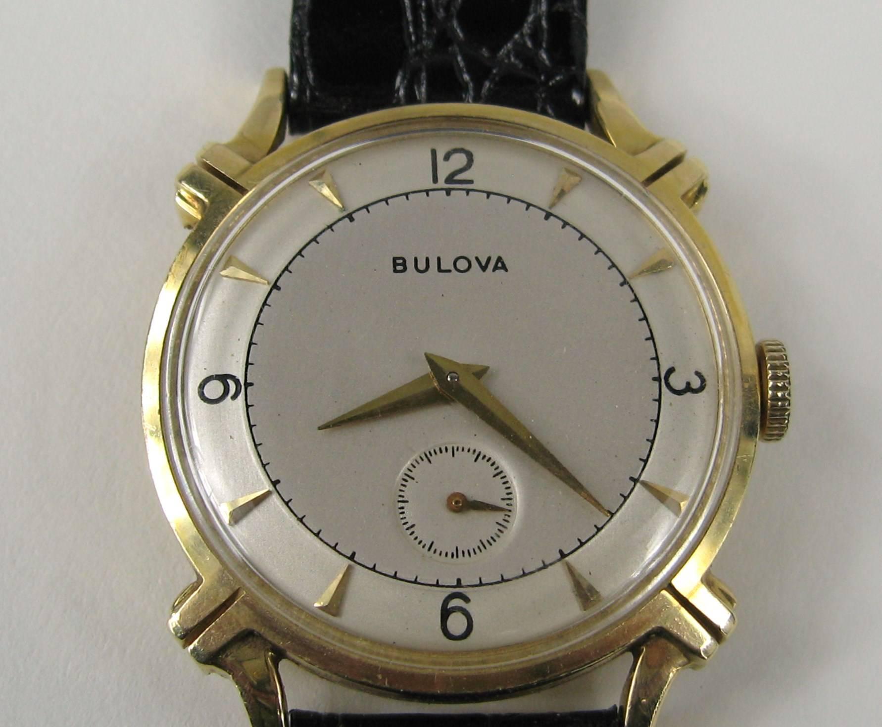 Stunning 14K gold Bulova Watch, this watch has had little use over it's years, Black Leather band. Measures Luge to Luge 38.6 mm or 1.5 in Width 31.97 mm or 1.26 in. It is In working order, Can be worn by a Man or Women. This is out of our massive
