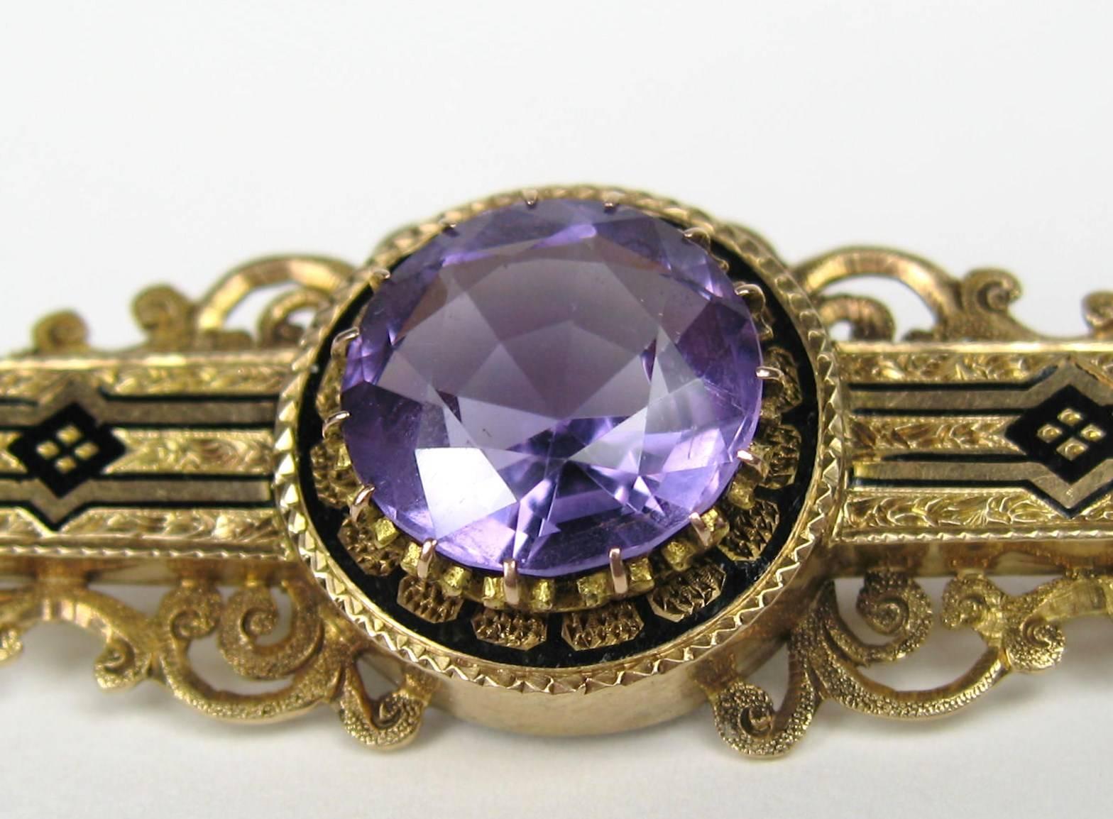 This is a 14K Gold Victorian Amethyst Bar Pin with Black Enamel work though it. It has a Claw set Large faceted Amethyst stone in the center. Measures 2.25 inches x .75 inches.  This is out of our massive collection of Hopi, Zuni, Navajo,