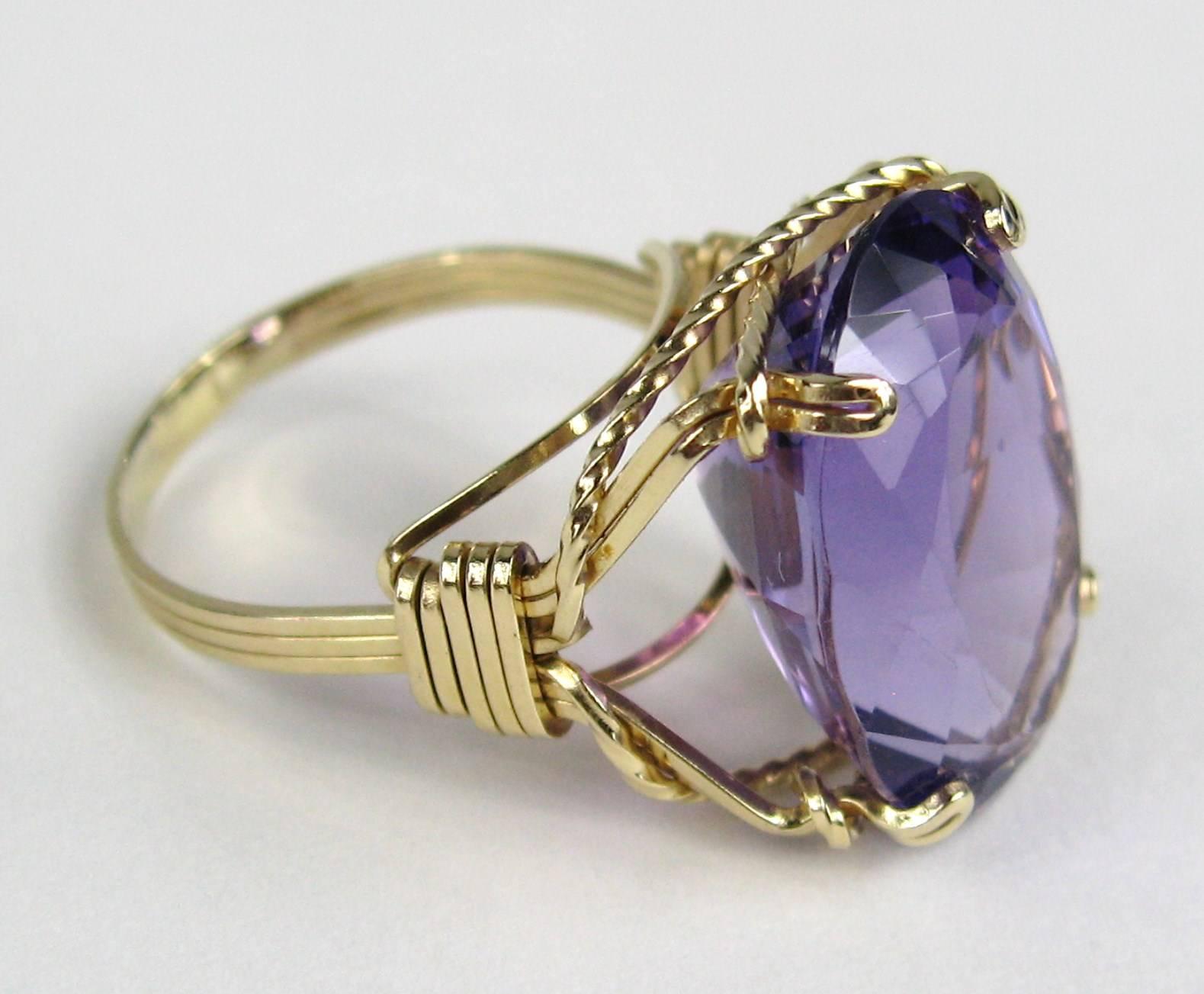Oval Amethyst set in a 14K Gold Setting Approximately 17.25 Carats. Sits .45 in up from your finger. It is a size 8.5 and can be sized by your jeweler or by us.  This is out of our massive collection of Hopi, Zuni, Navajo, Southwestern, sterling