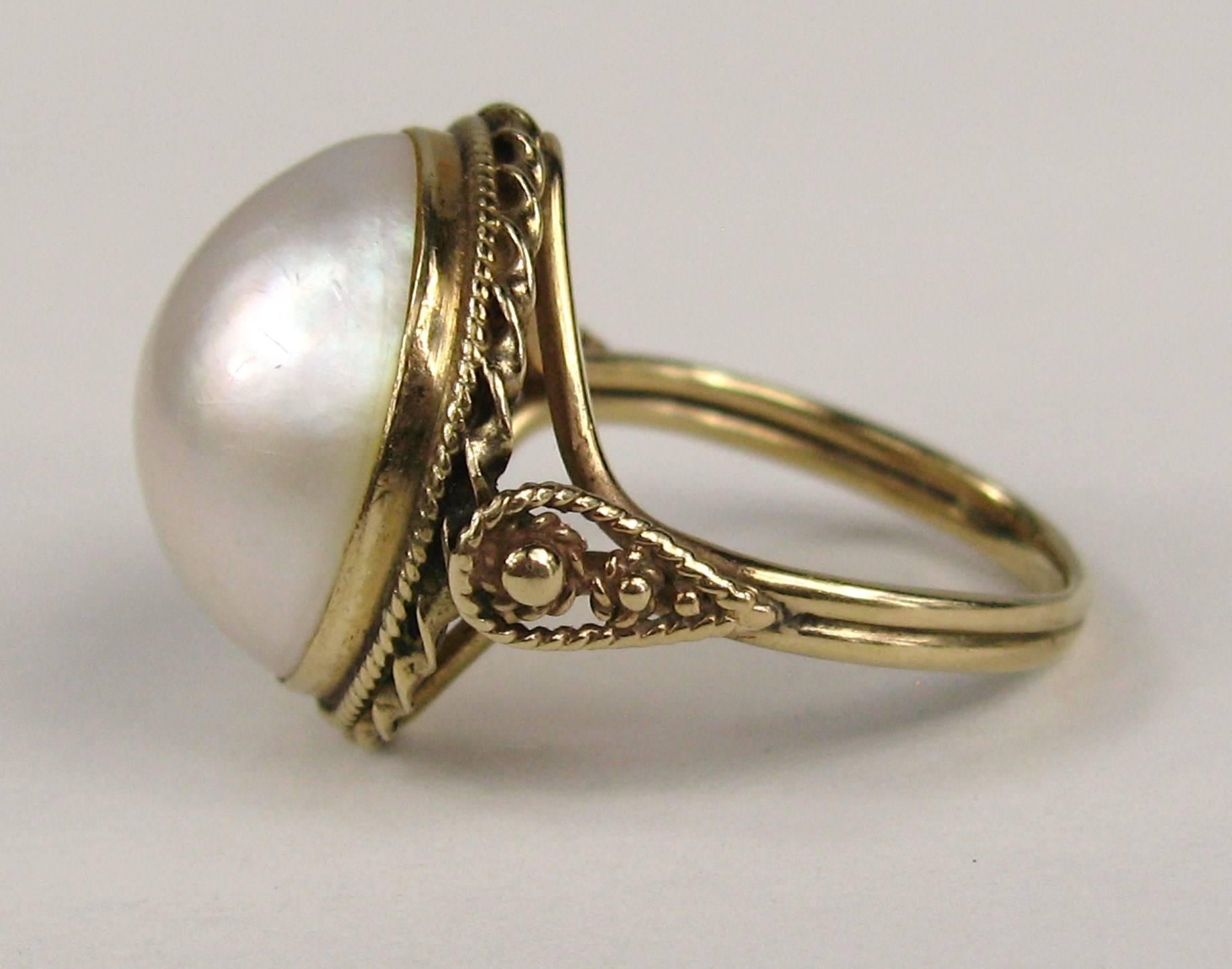 Wonderful Mabe Pearl Ring set in 14K Gold. Hand crafted setting. 17.5mm Mabe Pearl. Ring is a size 7-3/4. Ring can be size by us or by your jeweler.  This is out of our massive collection of Hopi, Zuni, Navajo, Southwestern, sterling silver, costume