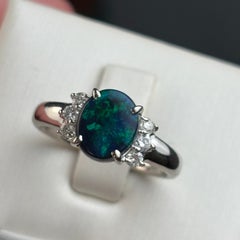 1.08 Carat Natural Oval Black Opal & Diamond Cluster Ring in Solid 18K