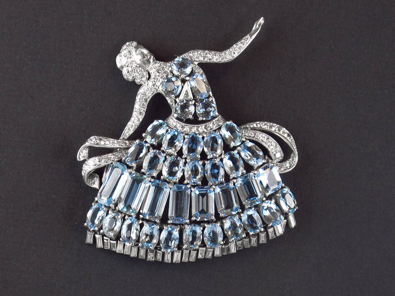 A platinum diamond and aquamarine Ballerina brooch. Probably American, circa 1935.