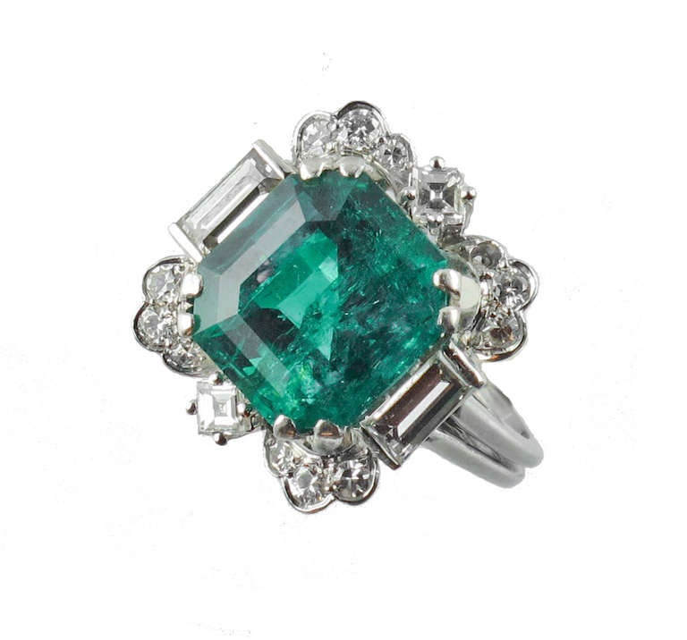 A very fine Platinum and Diamond ring centering a 8.10 carat Emerald. With CISGEM certificate stating that the emerald is Colombian with minor oil enhancement. Italy, circa 1940.