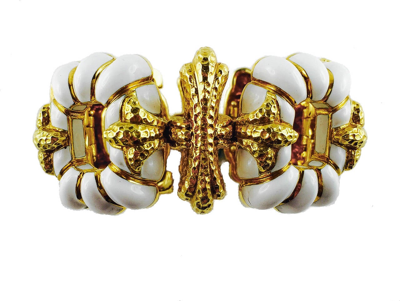 A yellow gold bracelet composed of white enamel plaques. Webb, 1970's