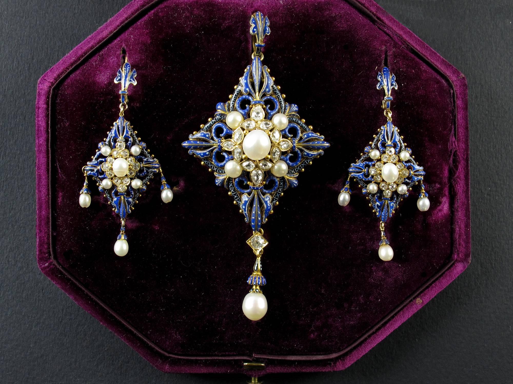 A very rare yellow gold enameled demi parure set with old-cut diamond and natural pearls. Composed of a pendant and a pair of earrings. C.Giuliano, 1870. In original fitted box of Hunt and Roskell.