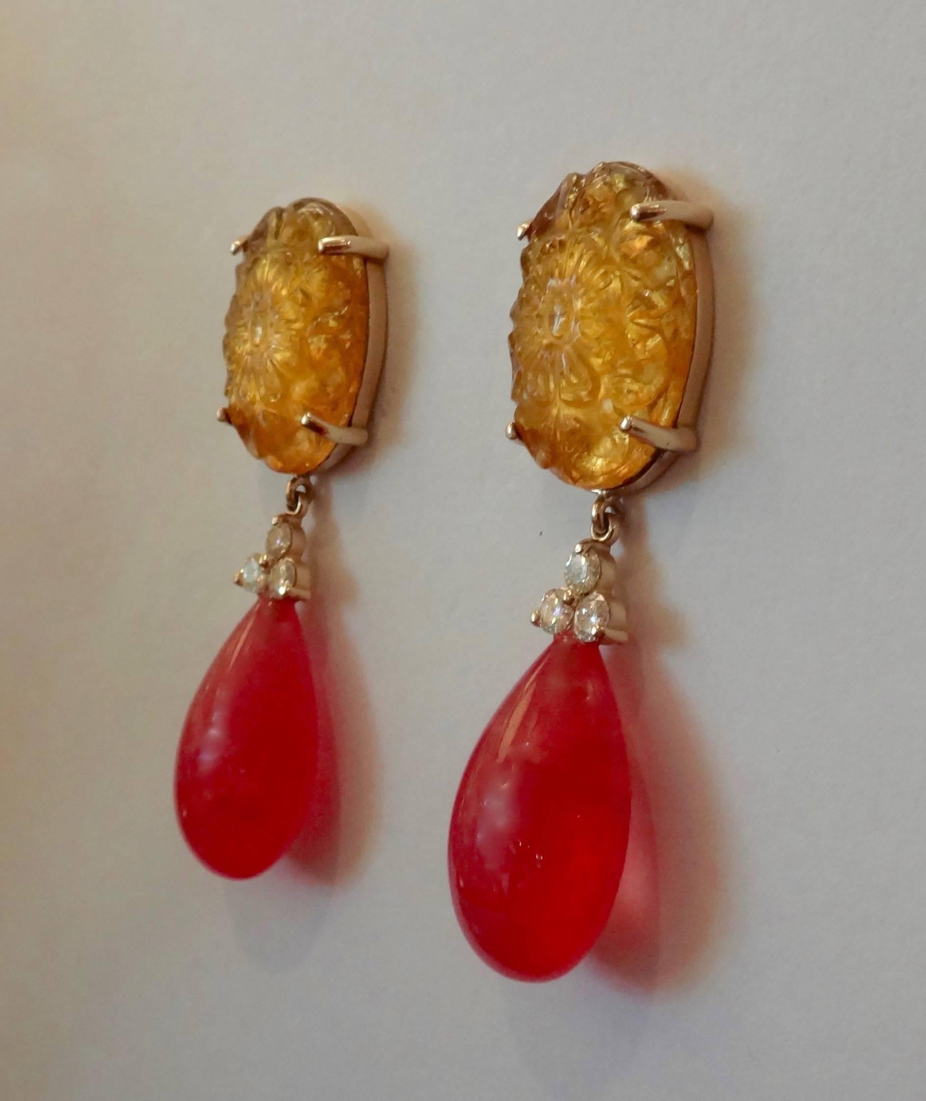 Carved citrines are paired with rare and gem quality rhodochrosite pendants (2 at 49.78 carats). Further decorating the earrings are 6 diamonds at .60 carats.  Post with extra large friction backs.  