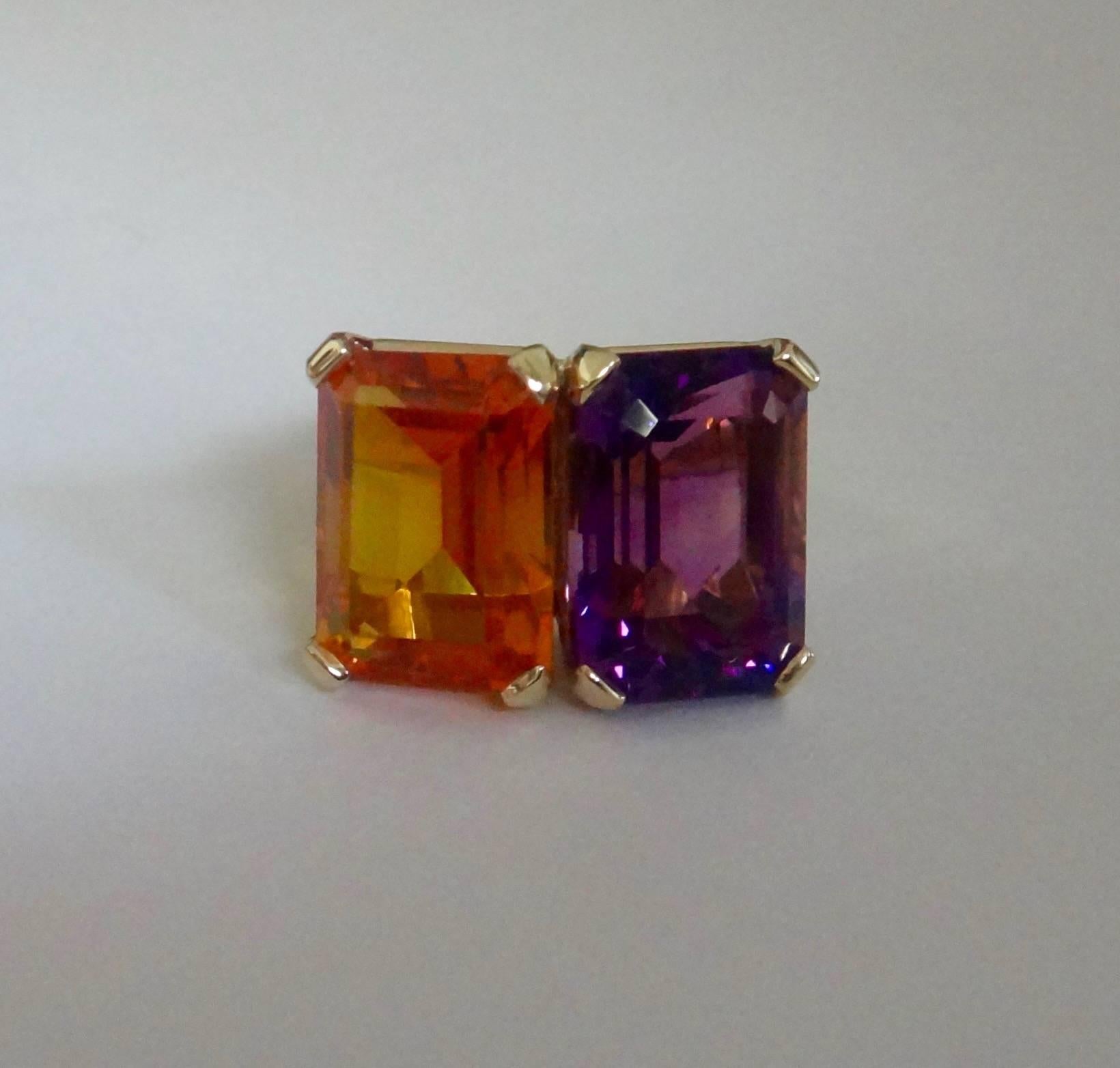 A matched pair of 14 x 10 mm Moroccan amethyst and Rio Grande citrine of highly intense and complimentary colors are set in a hand fabricated 18k yellow gold "Due Pietra" ring. The ring is a size 7 and readily sizable.   
