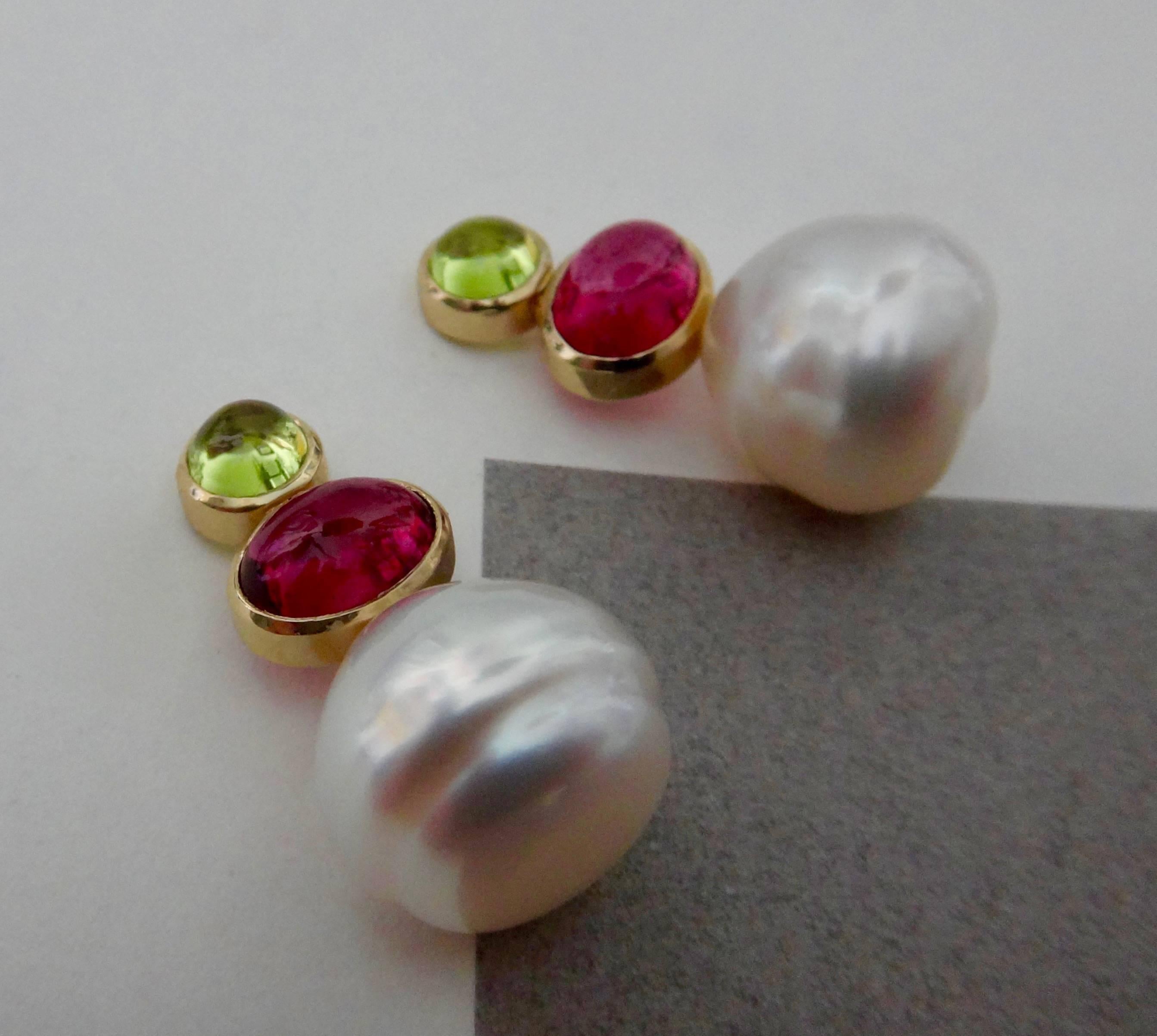 Baroque South Seas pearls are embellished with bezel set and cabochon cut peridots and pink tourmalines in these dainty drop earrings.  Post with friction backs.  