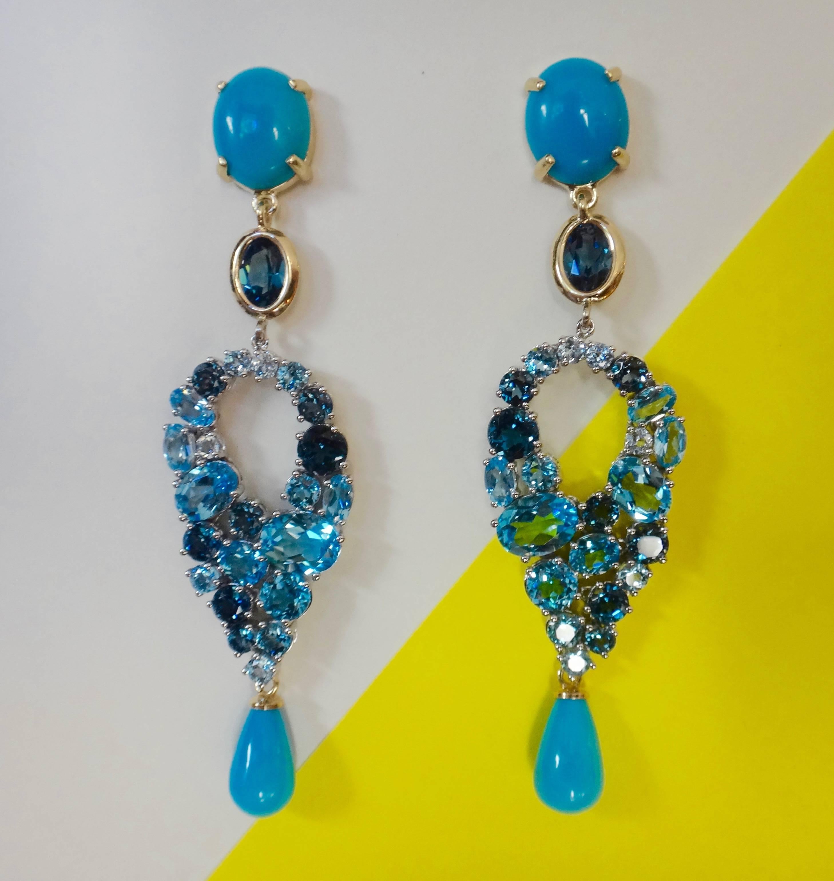 Sleeping Beauty turquoise cabochons and drops are combined with three shades of blue topaz of various shapes and sizes in these dramatic, one-of-a-kind dangle earrings.  The fabricated and articulated settings are in yellow and white gold.  Post