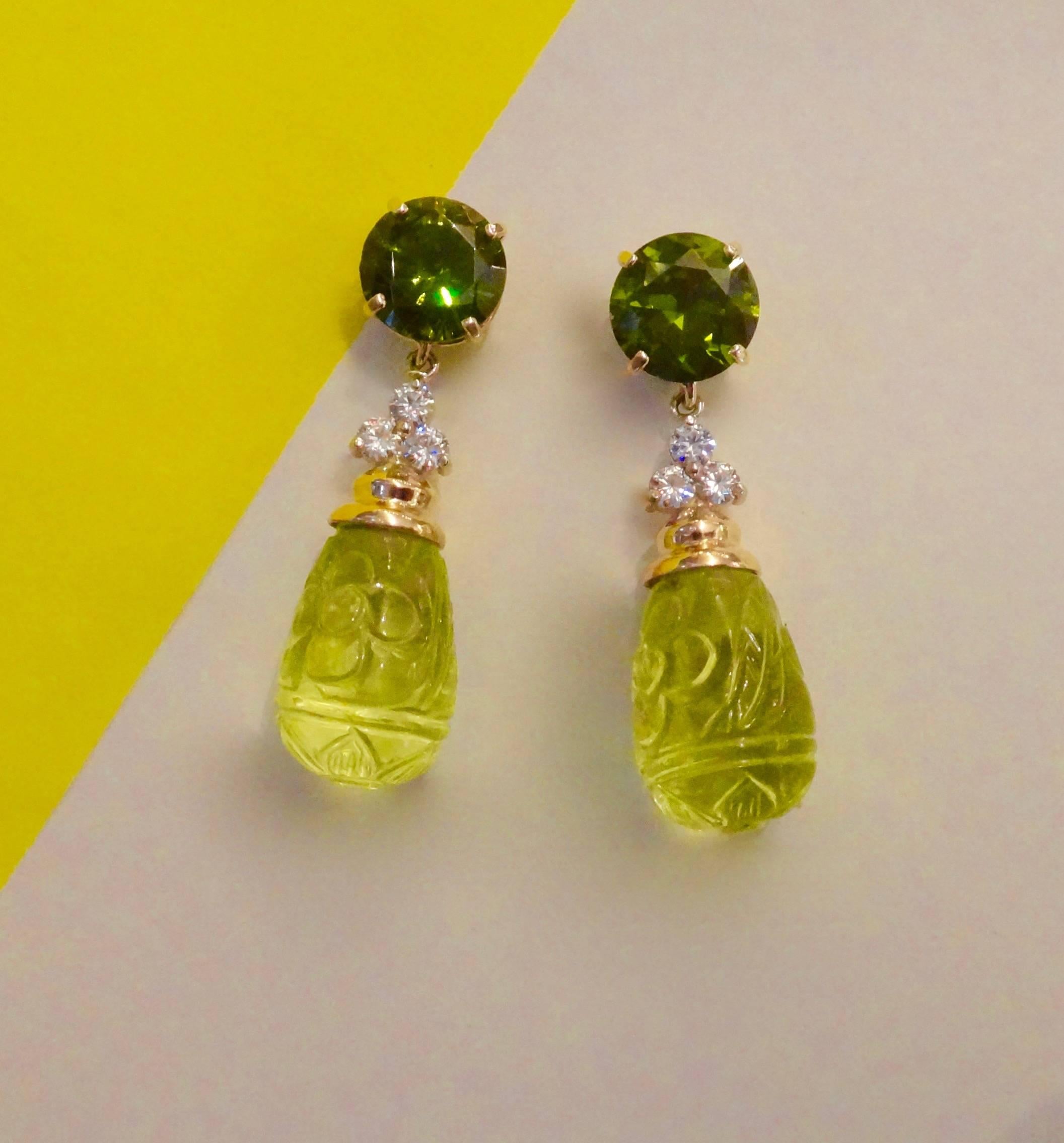 Brilliant cut forest green zircons (origin: Sri Lanka.) are paired with beautifully carved lemon citrine drops with a frosted finish in these dangle earrings.  Zircons occur in various colors including reddish brown, yellow, blue or in this case,