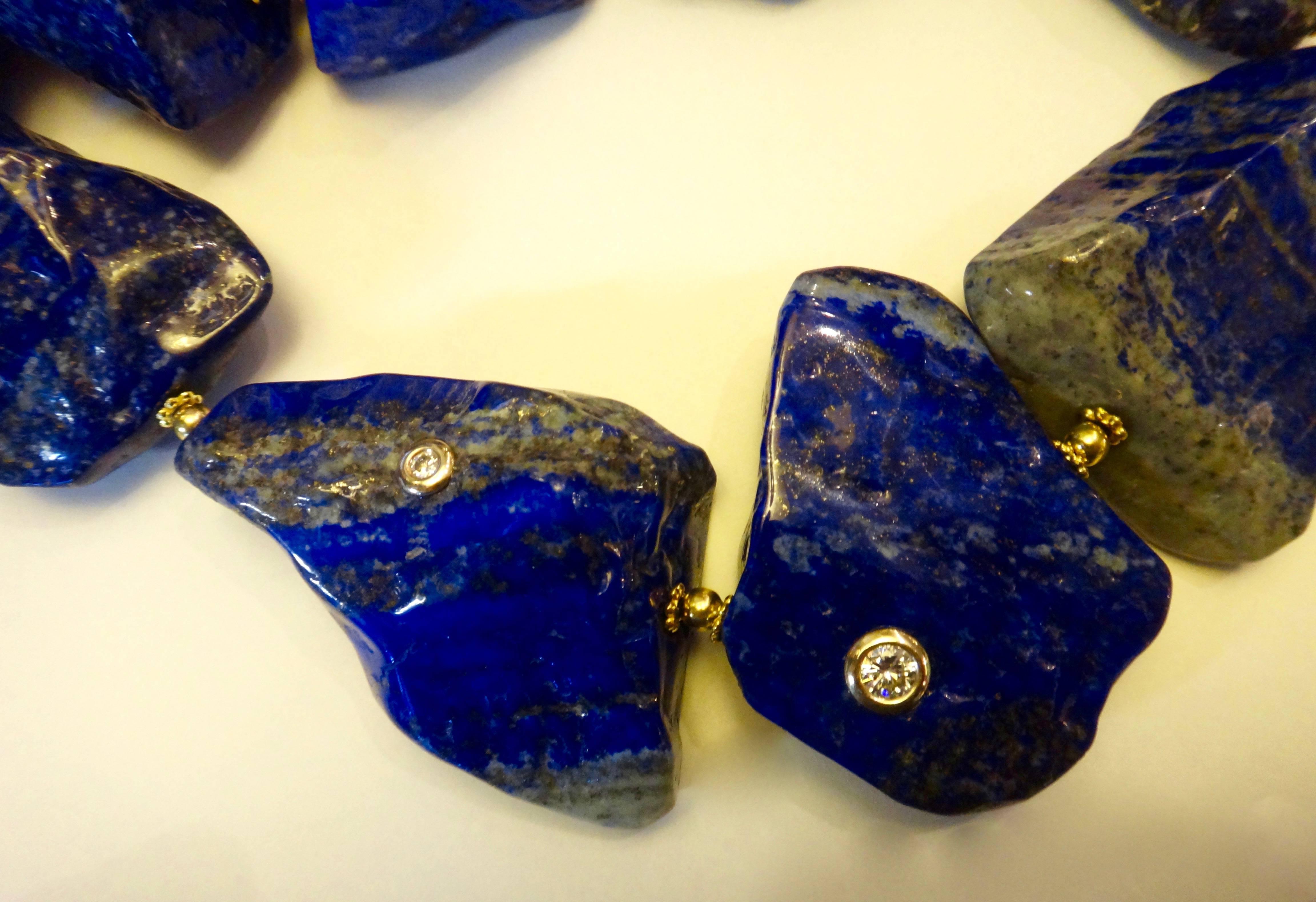 Highly polished nuggets of brightly colored lapis lazuli are decorated with three randomly placed white zircons.  Vermeil hook and eye clasp.  