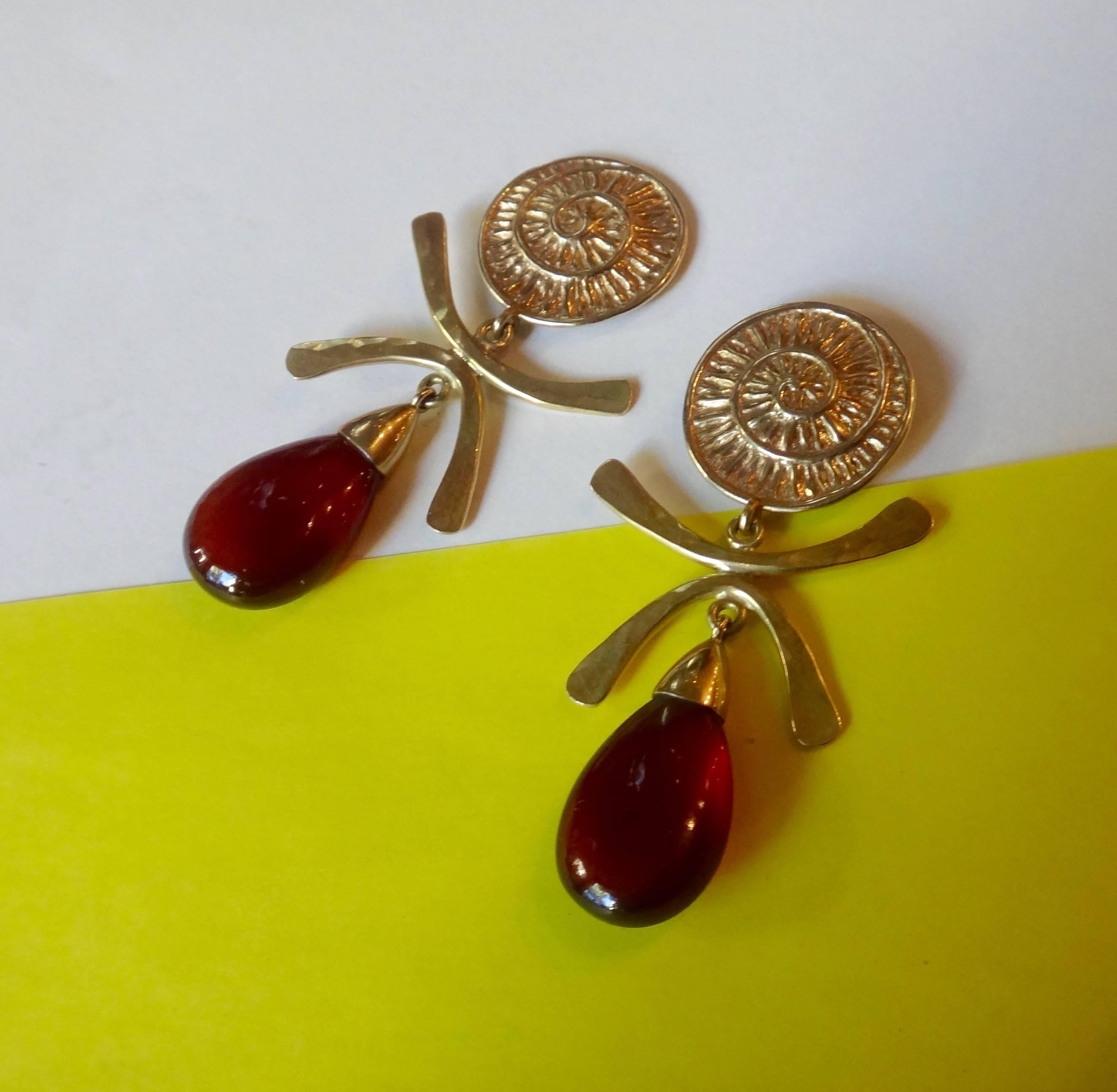 A beautifully finished and perfectly matched pair of hessonite garnets drops hang from forged and fabricated 18k yellow gold dangle earrings.  Post with jumbo friction backs.  