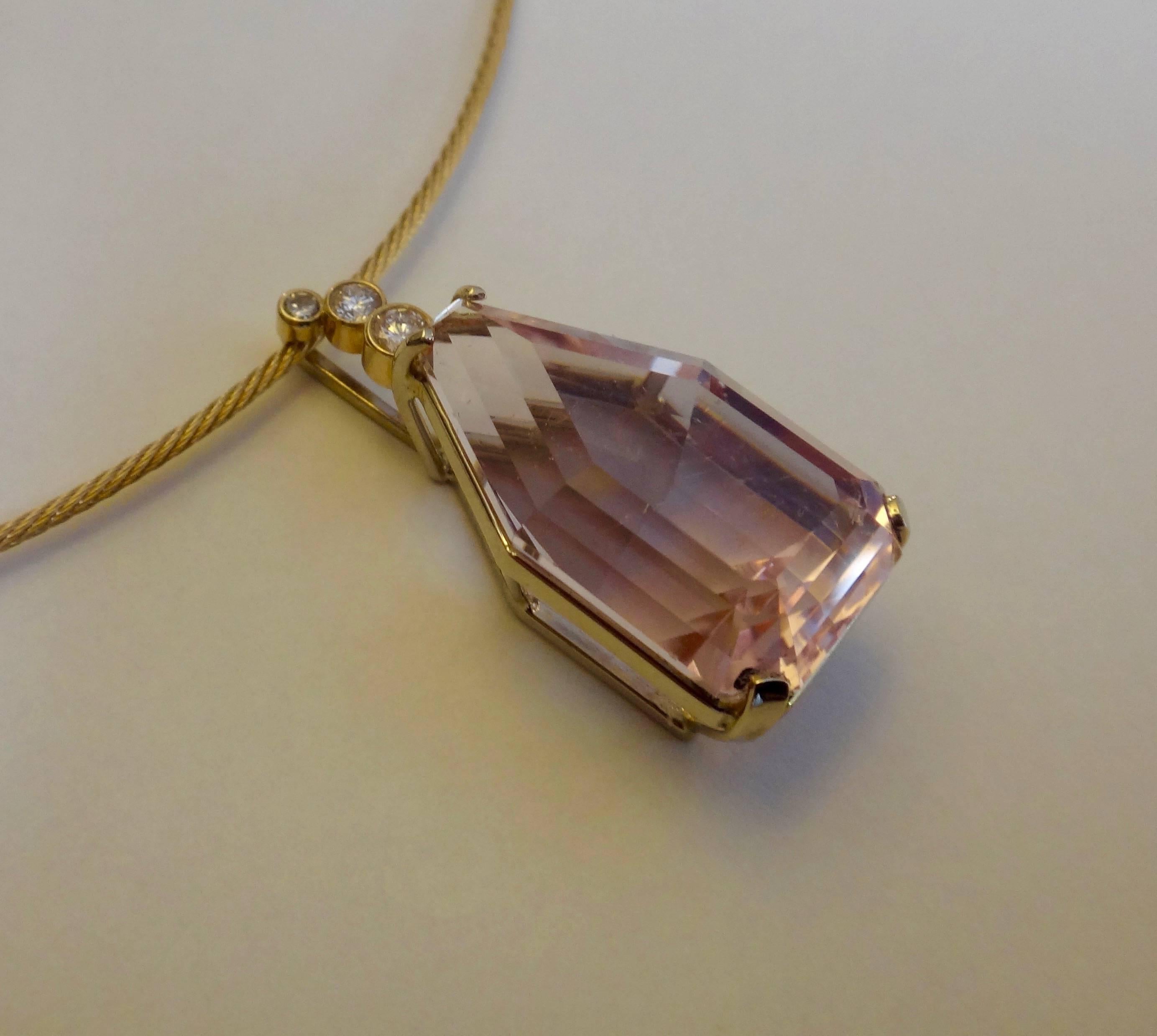The rough Morganite (a form of beryl, sister stones are aquamarine and emerald, among others) was collected in Namibia and custom cut by master gem cutter, Jerry Newman.  The shape of the rough crystal dictated the unique shape of this gem.  It is
