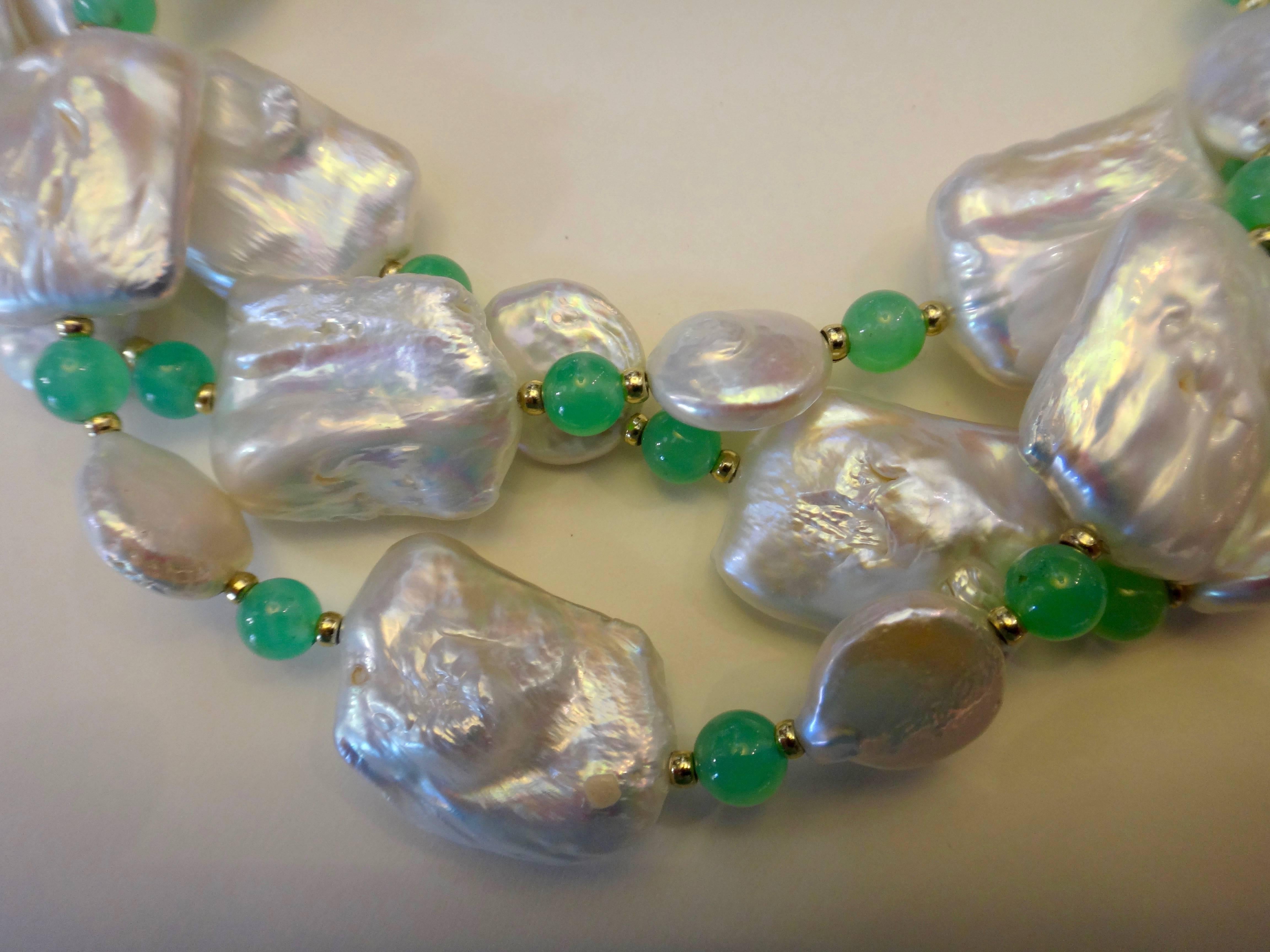 White tile pearls are combined with smaller white coin pearls, chrysoprase beads and gold rondel spacers in this beaded necklace.  The 39 inch long necklace can be worn as a single or double strand.  Vermeil hook clasp.  Perfect with Michael K.