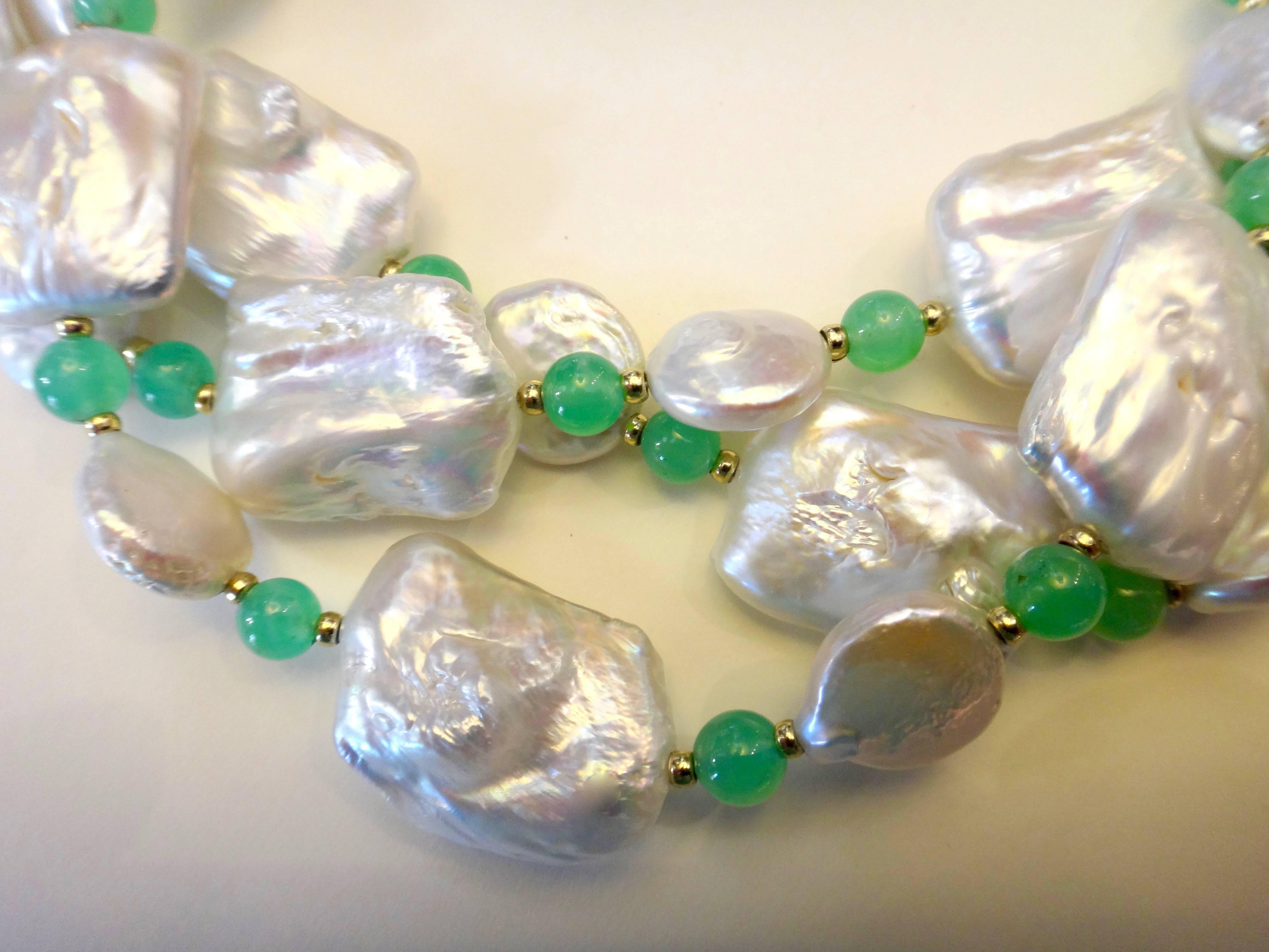 White tile pearls are spaced with smaller white coin pearls, chrysoprase beads and rondel spacers.  The necklace is 39 inches long and can be worn as a single or double strand necklace.  Vermeil hook clasp.