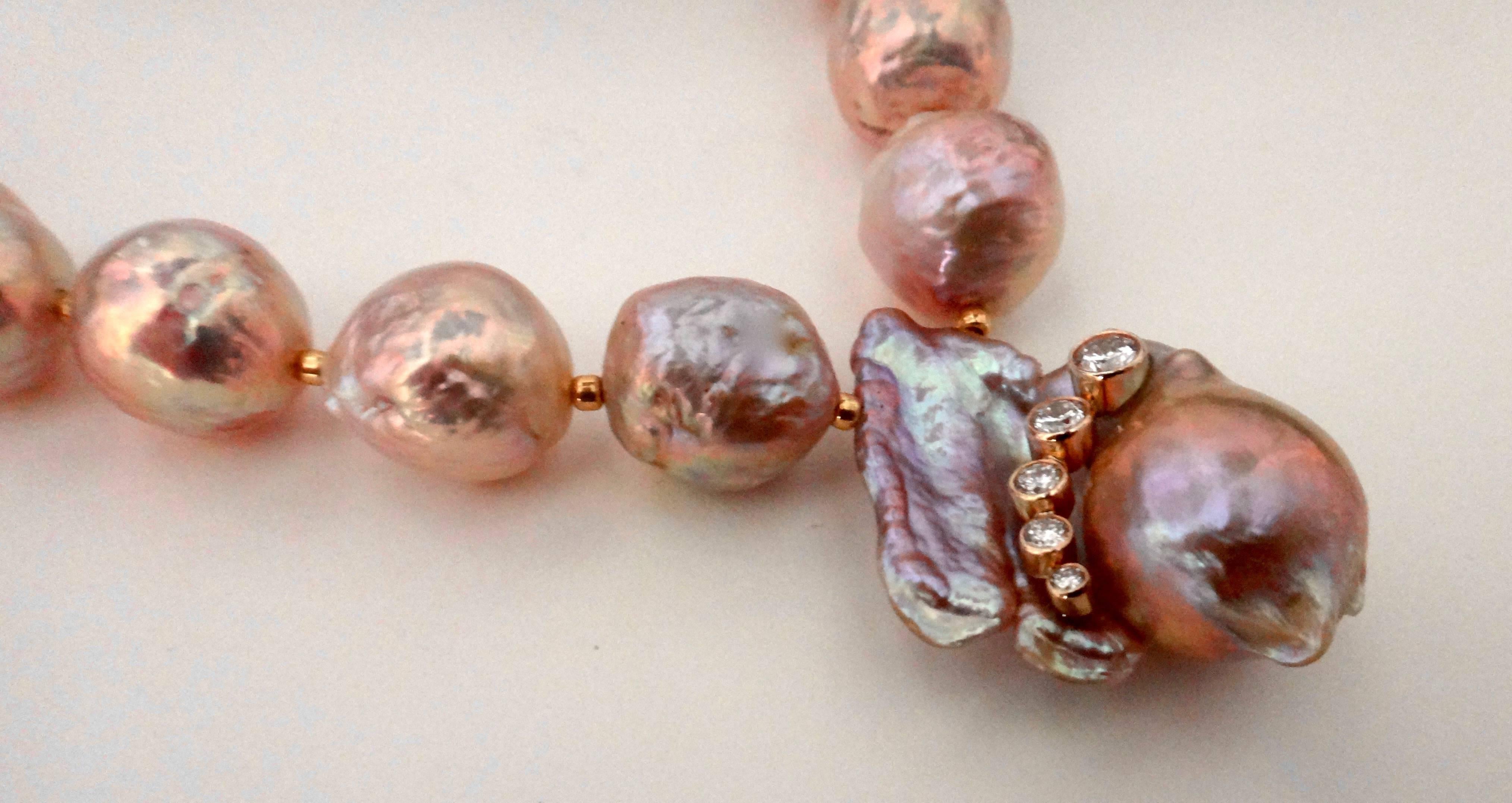 Shell pink Kasumi pearl necklace.  Kasumi pearls are large freshwater pearls with a shell bead nucleus. They are cultivated in the upstream areas of Lake Kasumi-ga-Ura, some 40 miles northeast of Tokyo.  Centered in this necklace is a very large (1