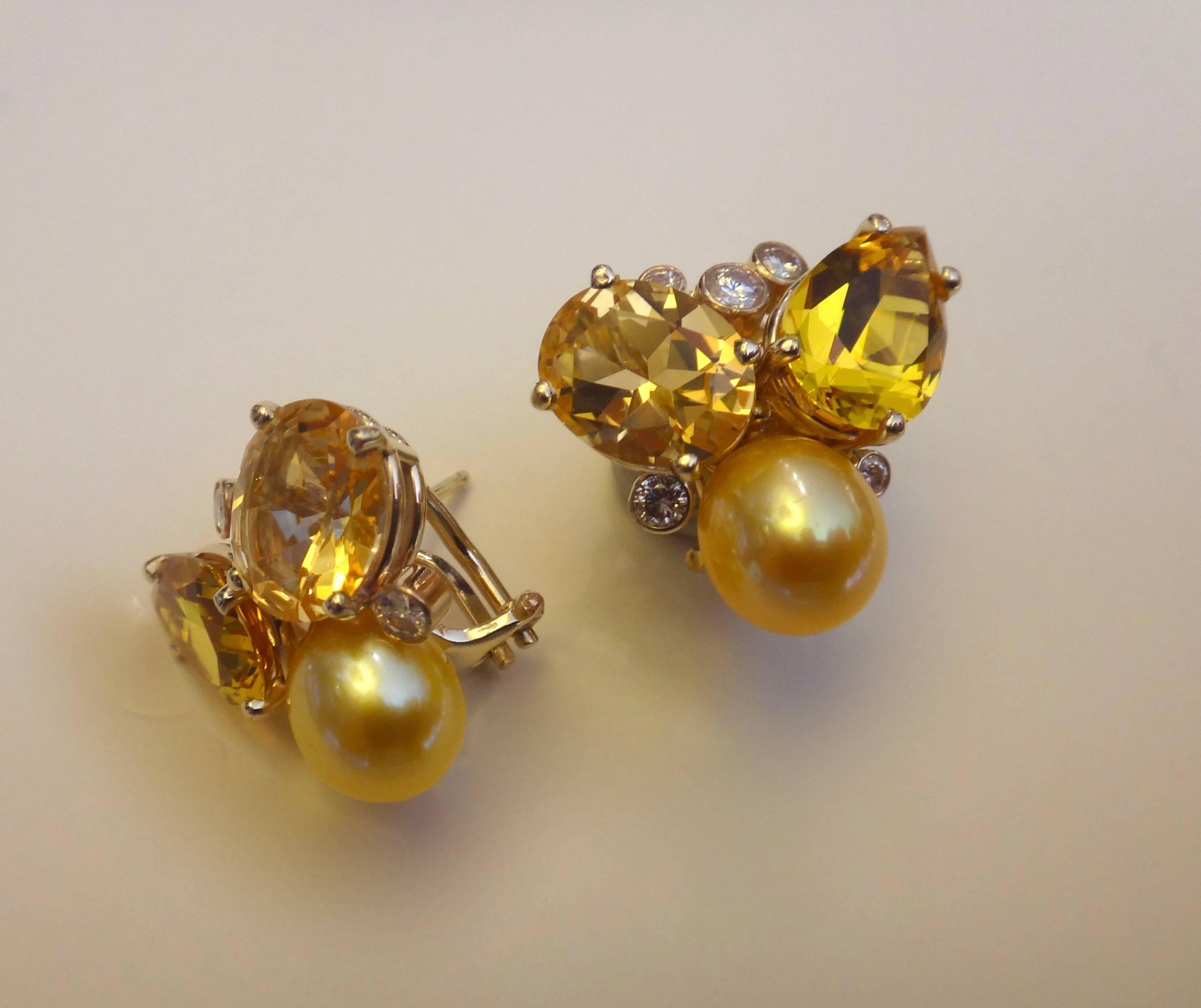  Oval cut golden topaz, pear shaped citrines, golden pearls and white diamonds are combined in these bright and glittering Confetti earrings.  The gems are both prong and bezel set.  The earrings come with post and omega clips for comfort and